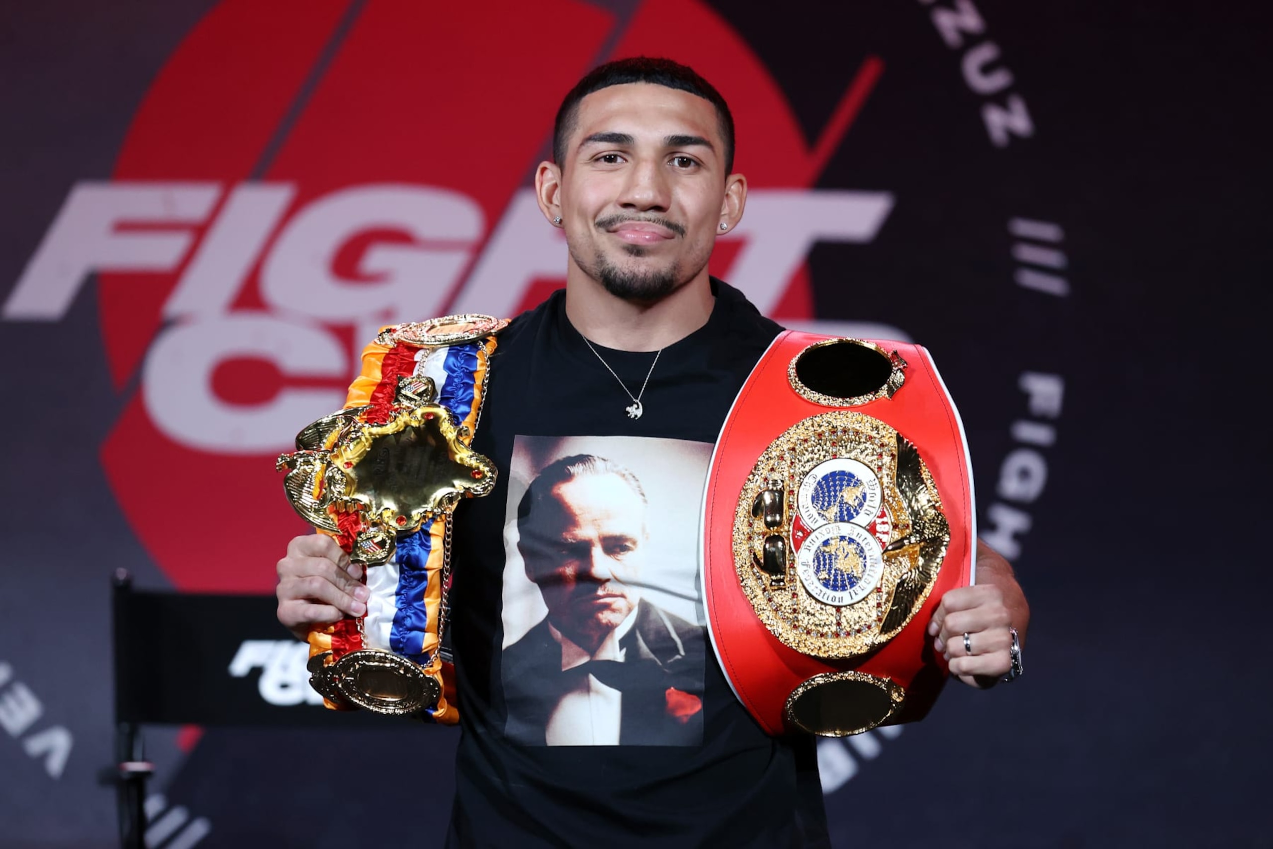 ATLANTA, GEORGIA - APRIL 16: Teofimo Lopez poses with his championship belts during a press conference for Triller Fight Club at Mercedes-Benz Stadium on April 16, 2021 in Atlanta, Georgia ahead of his June 5 lightweight title fight against George Kambosos Jr. (Photo by Al Bello/Getty Images for Triller)