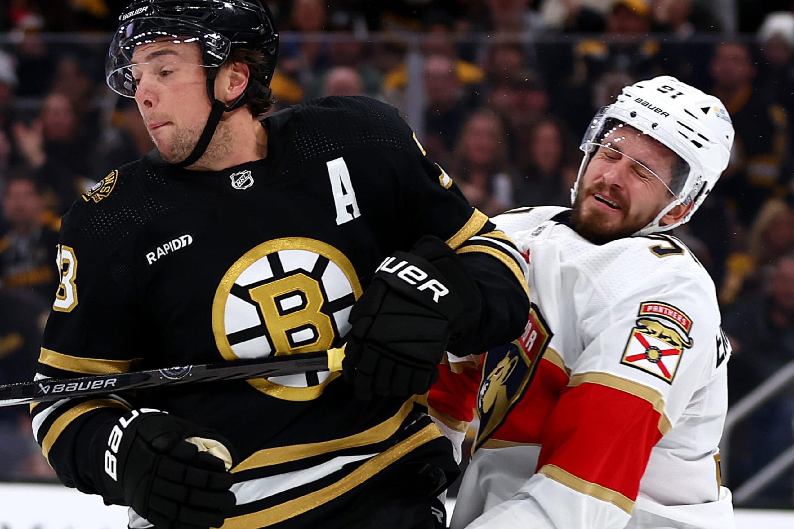 BOSTON, MASSACHUSETTS - OCTOBER 30: Charlie McAvoy #73 of the Boston Bruins commits an illegal check to the head against Oliver Ekman-Larsson #91 of the Florida Panthers during the third period at TD Garden on October 30, 2023 in Boston, Massachusetts. (Photo by Maddie Meyer/Getty Images)