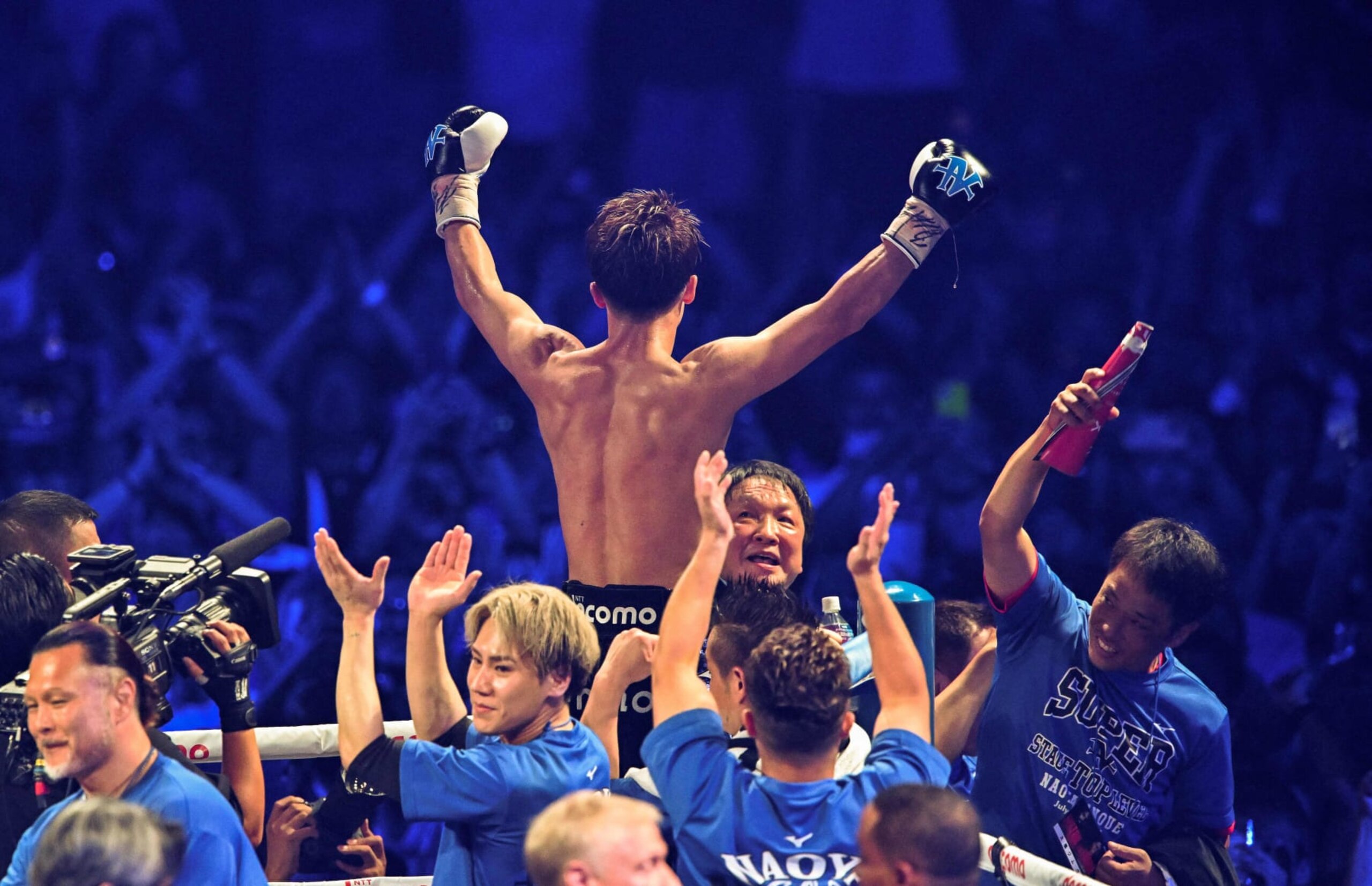 Naoya Inoue of Japan (top) celebrates his win over Stephen Fulton of the US (bottom) in the WBC, WBO super bantamweight world title match at Ariake Arena in Tokyo on July 25, 2023. (Photo by Kazuhiro NOGI / AFP) (Photo by KAZUHIRO NOGI/AFP via Getty Images)