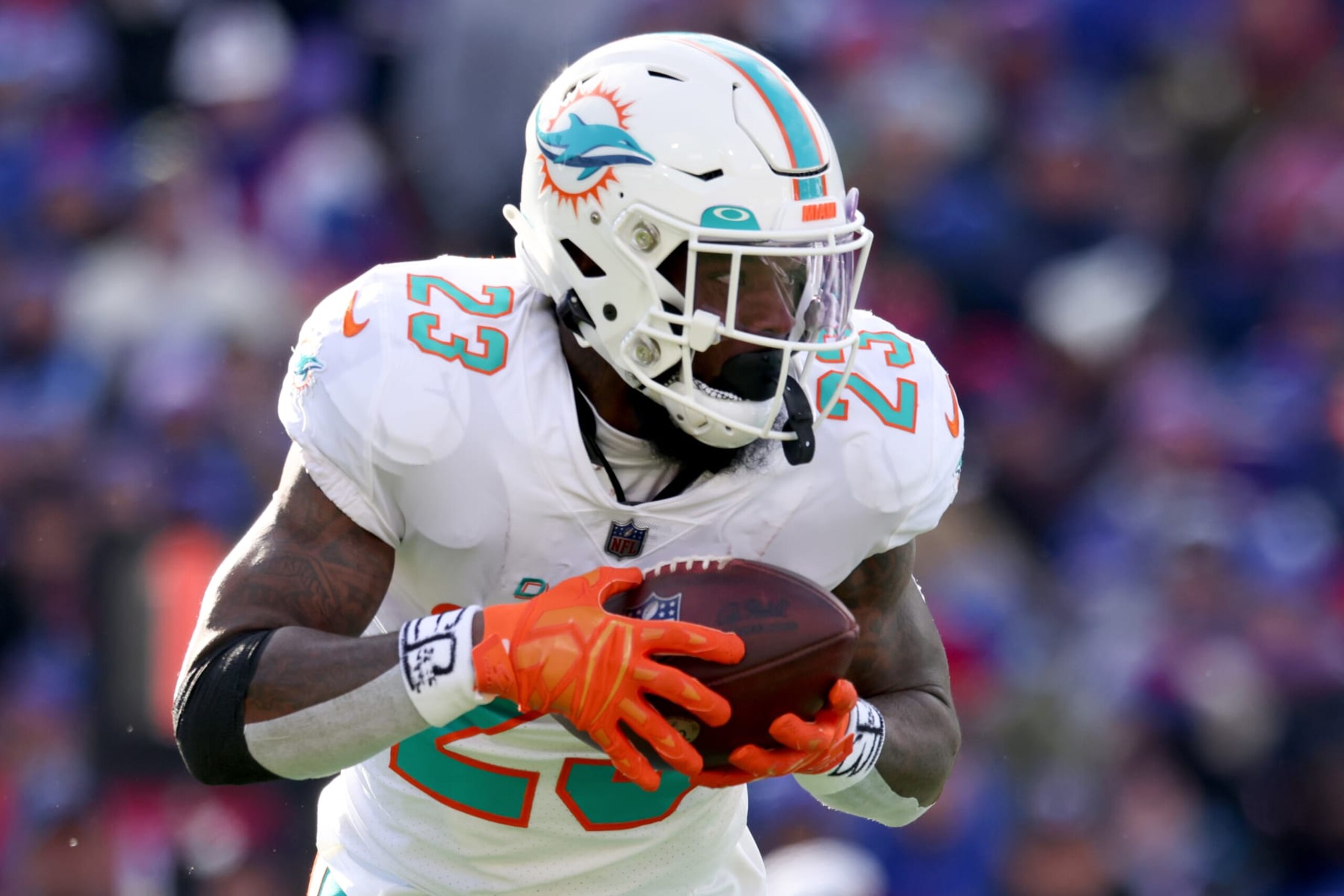 ORCHARD PARK, NEW YORK - JANUARY 15: Jeff Wilson Jr. #23 of the Miami Dolphins carries the ball against the Buffalo Bills during the first half of the game in the AFC Wild Card playoff game at Highmark Stadium on January 15, 2023 in Orchard Park, New York. (Photo by Bryan M. Bennett/Getty Images)