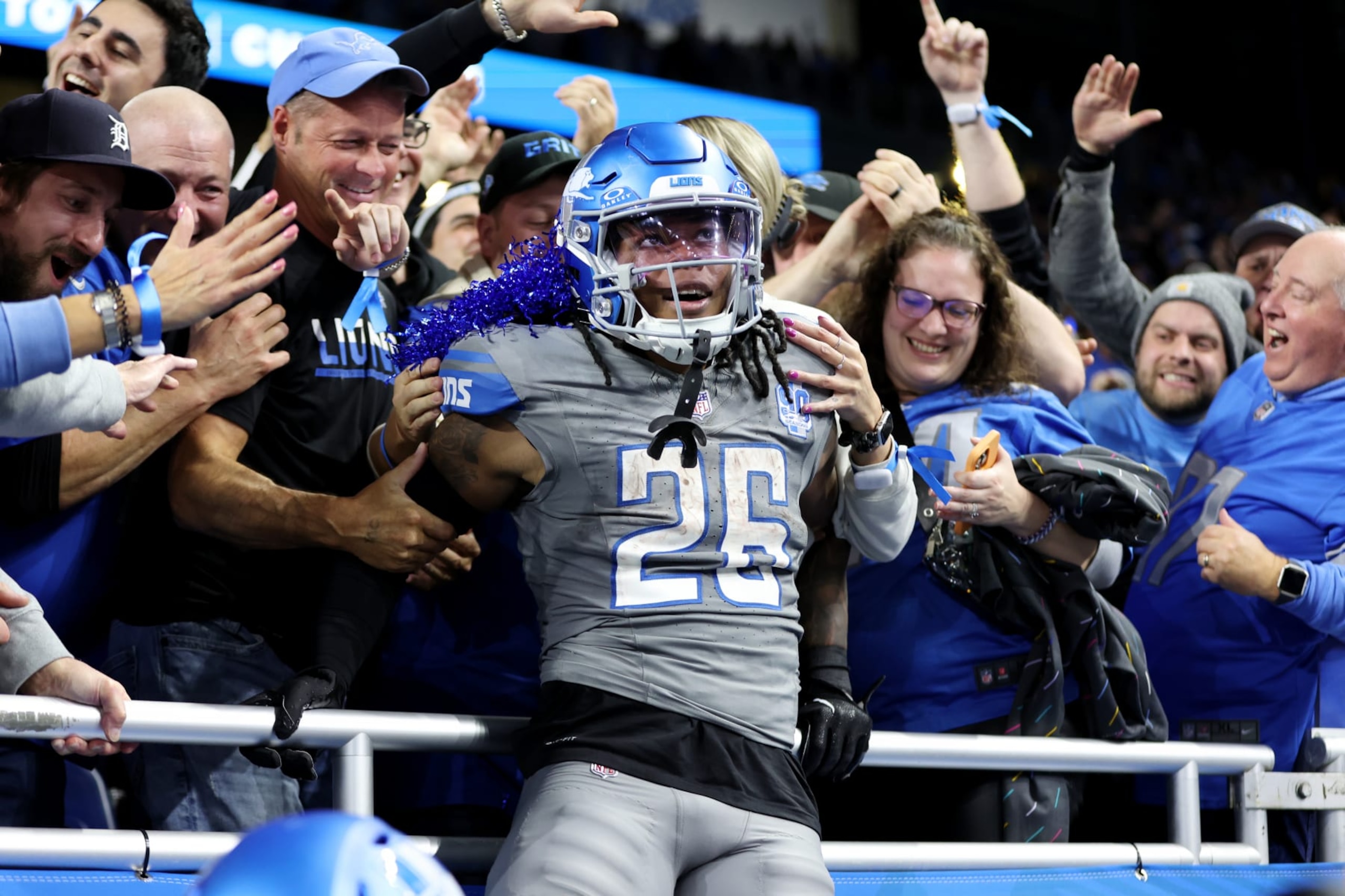 DETROIT, MICHIGAN - OCTOBER 30: Jahmyr Gibbs #26 of the Detroit Lions celebrates his touchdown with fans in the third quarter against the Las Vegas Raiders at Ford Field on October 30, 2023 in Detroit, Michigan. (Photo by Gregory Shamus/Getty Images)