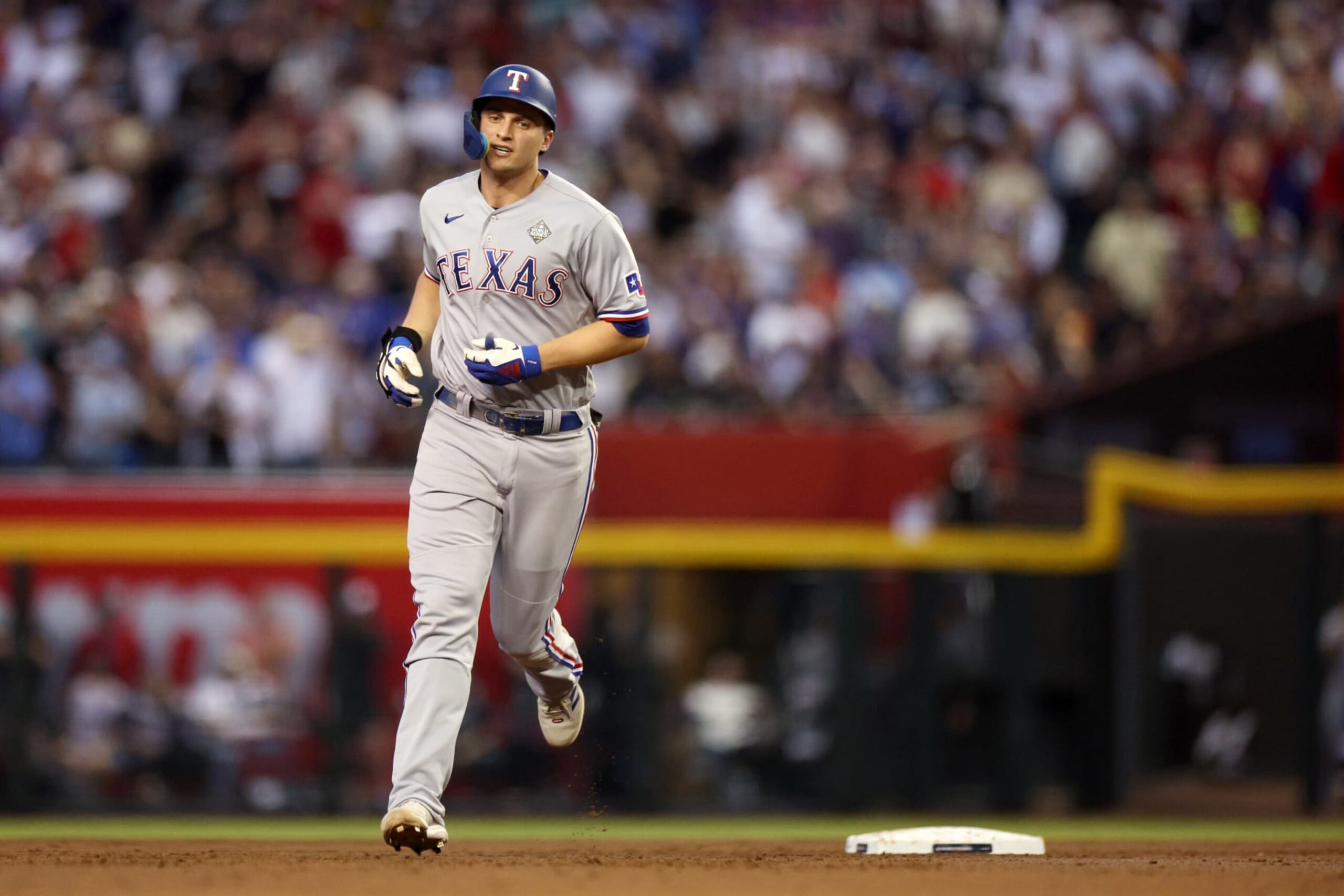 PHOENIX, ARIZONA - OCTOBER 31: Corey Seager #5 of the Texas Rangers rounds the bases after hitting a home run in the second inning against the Arizona Diamondbacks during Game Four of the World Series at Chase Field on October 31, 2023 in Phoenix, Arizona. (Photo by Harry How/Getty Images)