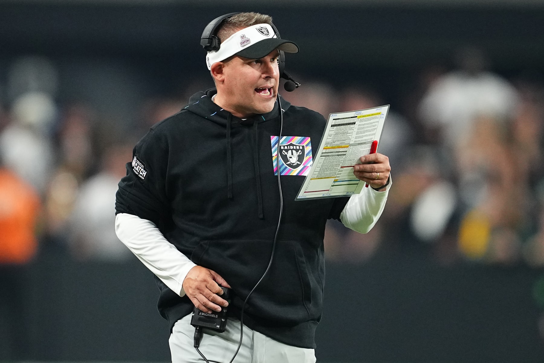 LAS VEGAS, NEVADA - OCTOBER 09: Head coach Josh McDaniels of the Las Vegas Raiders calls a play during the fourth quarter against the Green Bay Packers at Allegiant Stadium on October 09, 2023 in Las Vegas, Nevada. (Photo by Chris Unger/Getty Images)