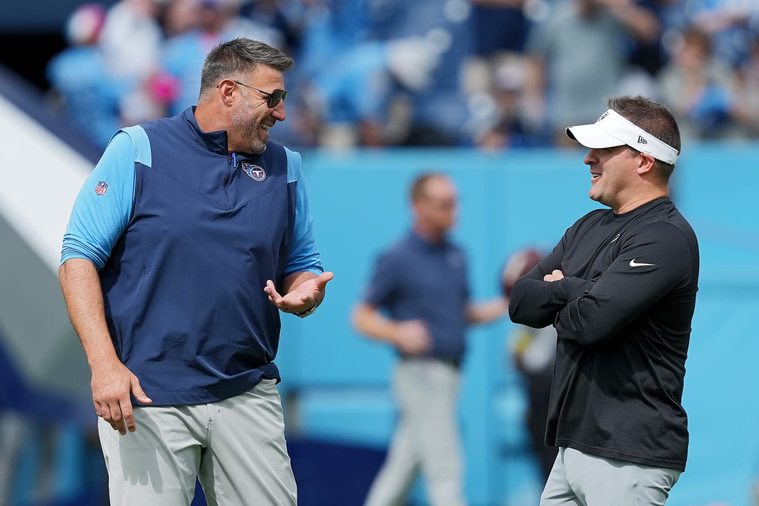 NASHVILLE, TENNESSEE - SEPTEMBER 25: Head coaches Mike Vrabel (L) of the Tennessee Titans and Josh McDaniels of the Las Vegas Raiders interact before the game at Nissan Stadium on September 25, 2022 in Nashville, Tennessee. (Photo by Dylan Buell/Getty Images) NASHVILLE, TENNESSEE - SEPTEMBER 25: Head coaches Mike Vrabel (L) of the Tennessee Titans and Josh McDaniels of the Las Vegas Raiders interact before the game at Nissan Stadium on September 25, 2022 in Nashville, Tennessee. (Photo by Dylan Buell/Getty Images)