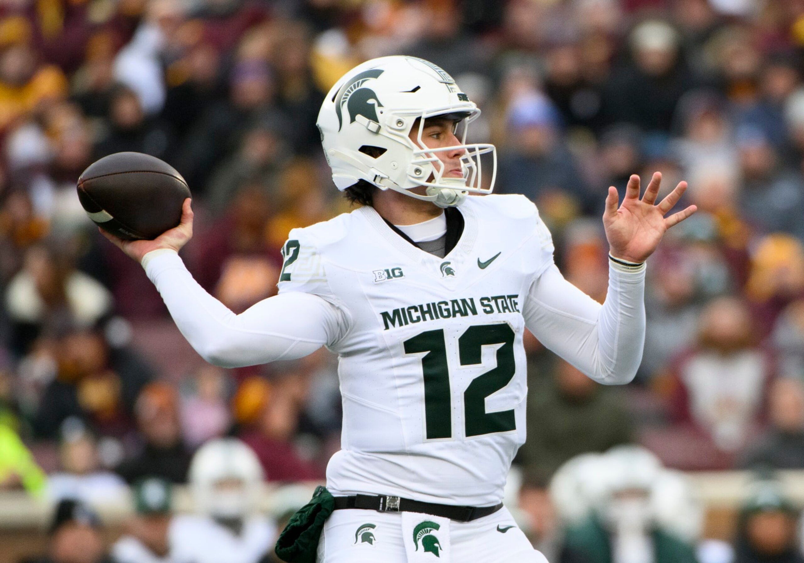 MINNEAPOLIS, MINNESOTA - OCTOBER 28: Katin Houser #12 of the Michigan State Spartans passes ball in the third quarter of the game against the Minnesota Golden Gophers at Huntington Bank Stadium on October 28, 2023 in Minneapolis, Minnesota. (Photo by Stephen Maturen/Getty Images)