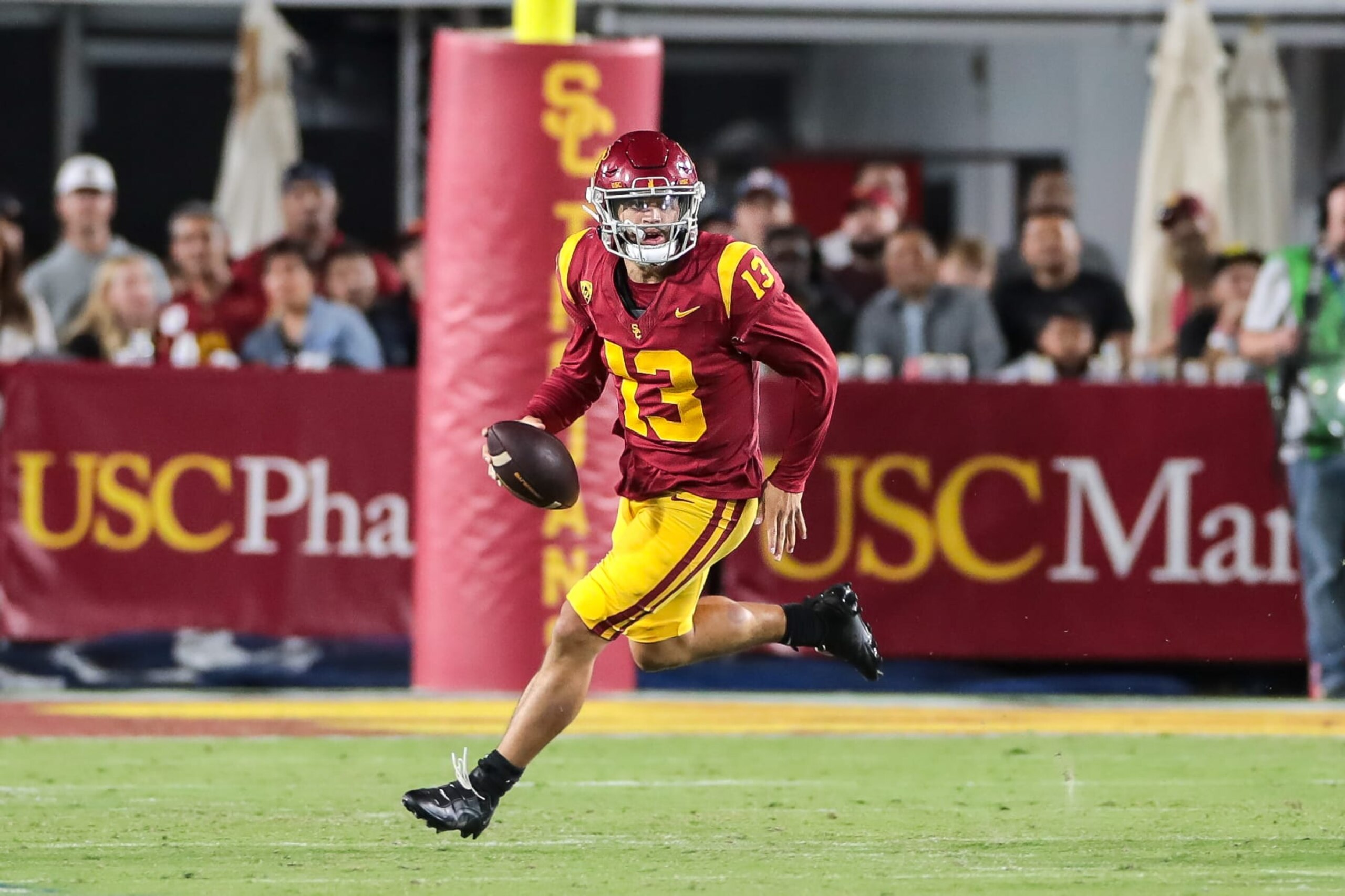 LOS ANGELES, CA - OCTOBER 21: USC Trojans quarterback Caleb Williams (13) scrambles during the college football game between the Utah Utes and the USC Trojans on October 21, 2023, at the Los Angeles Memorial Coliseum in Los Angeles, CA.(Photo by Jevone Moore/Icon Sportswire via Getty Images)