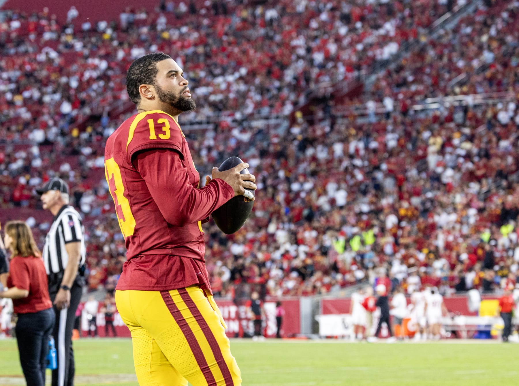 LOS ANGELES, CA  - OCTOBER 21, 2023: USC Trojans  quarterback Caleb Williams looks up at the score board while staying loose during a timeout in the 34-32 loss to Utah at LA Memorial Coliseum on October 21,  2023 in Los Angeles, California.(Gina Ferazzi / Los Angeles Times via Getty Images)