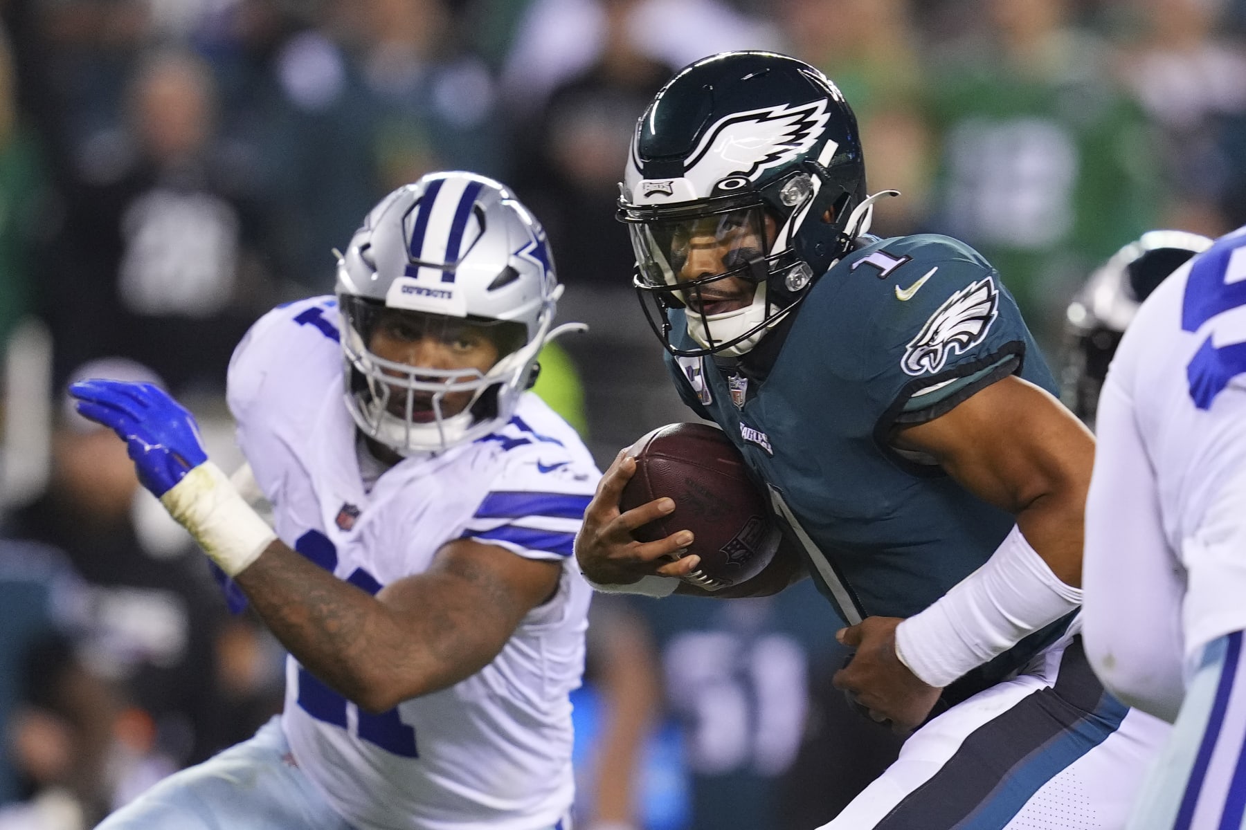 PHILADELPHIA, PA - OCTOBER 16: Jalen Hurts #1 of the Philadelphia Eagles runs the ball against Micah Parsons #11 of the Dallas Cowboys at Lincoln Financial Field on October 16, 2022 in Philadelphia, Pennsylvania. (Photo by Mitchell Leff/Getty Images)