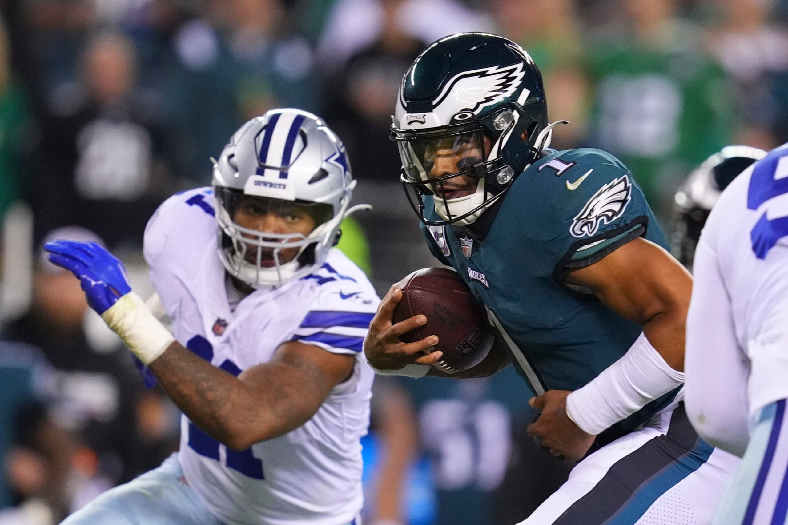 PHILADELPHIA, PA - OCTOBER 16: Jalen Hurts #1 of the Philadelphia Eagles runs the ball against Micah Parsons #11 of the Dallas Cowboys at Lincoln Financial Field on October 16, 2022 in Philadelphia, Pennsylvania. (Photo by Mitchell Leff/Getty Images) PHILADELPHIA, PA - OCTOBER 16: Jalen Hurts #1 of the Philadelphia Eagles runs the ball against Micah Parsons #11 of the Dallas Cowboys at Lincoln Financial Field on October 16, 2022 in Philadelphia, Pennsylvania. (Photo by Mitchell Leff/Getty Images)