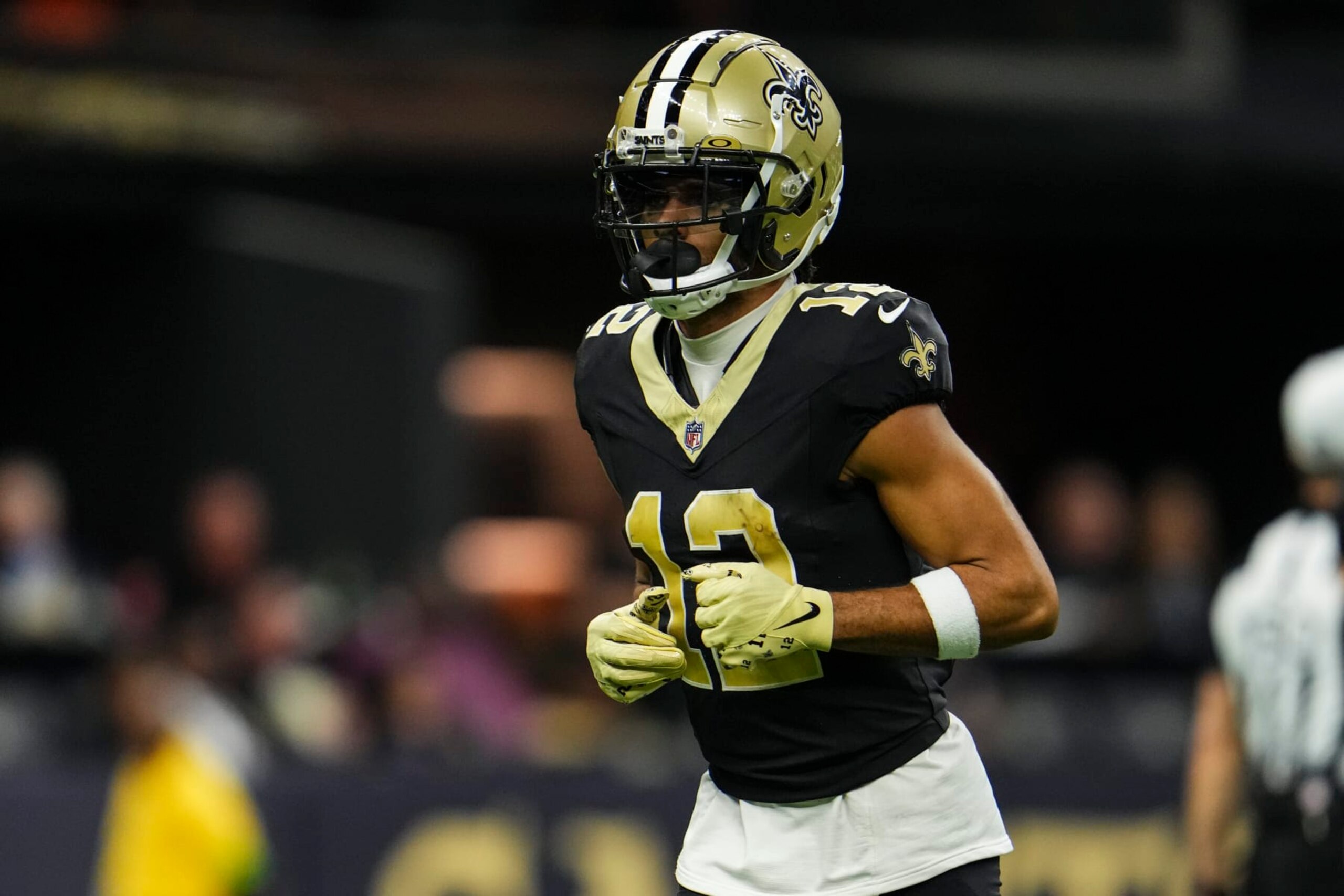 NEW ORLEANS, LA - OCTOBER 19: Chris Olave #12 of the New Orleans Saints runs across the field during an NFL football game against the Jacksonville Jaguars at Caesars Superdome on October 19, 2023 in New Orleans, Louisiana. (Photo by Cooper Neill/Getty Images) NEW ORLEANS, LA - OCTOBER 19: Chris Olave #12 of the New Orleans Saints runs across the field during an NFL football game against the Jacksonville Jaguars at Caesars Superdome on October 19, 2023 in New Orleans, Louisiana. (Photo by Cooper Neill/Getty Images)