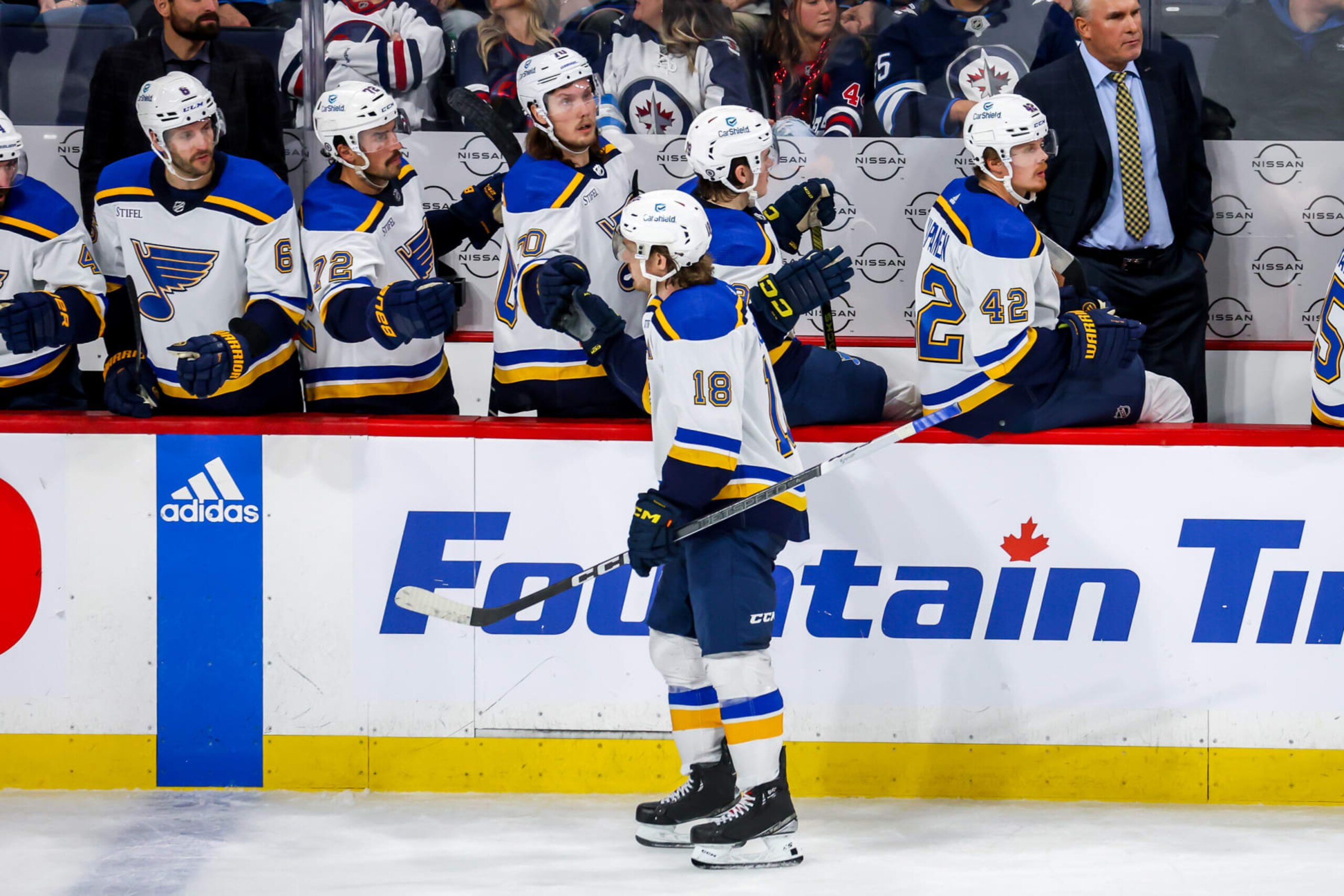 WINNIPEG, CANADA - OCTOBER 24: Robert Thomas #18 of the St. Louis Blues celebrates his third period goal against the Winnipeg Jets with teammates at the bench at the Canada Life Centre on October 24, 2023 in Winnipeg, Manitoba, Canada. (Photo by Jonathan Kozub/NHLI via Getty Images) WINNIPEG, CANADA - OCTOBER 24: Robert Thomas #18 of the St. Louis Blues celebrates his third period goal against the Winnipeg Jets with teammates at the bench at the Canada Life Centre on October 24, 2023 in Winnipeg, Manitoba, Canada. (Photo by Jonathan Kozub/NHLI via Getty Images)