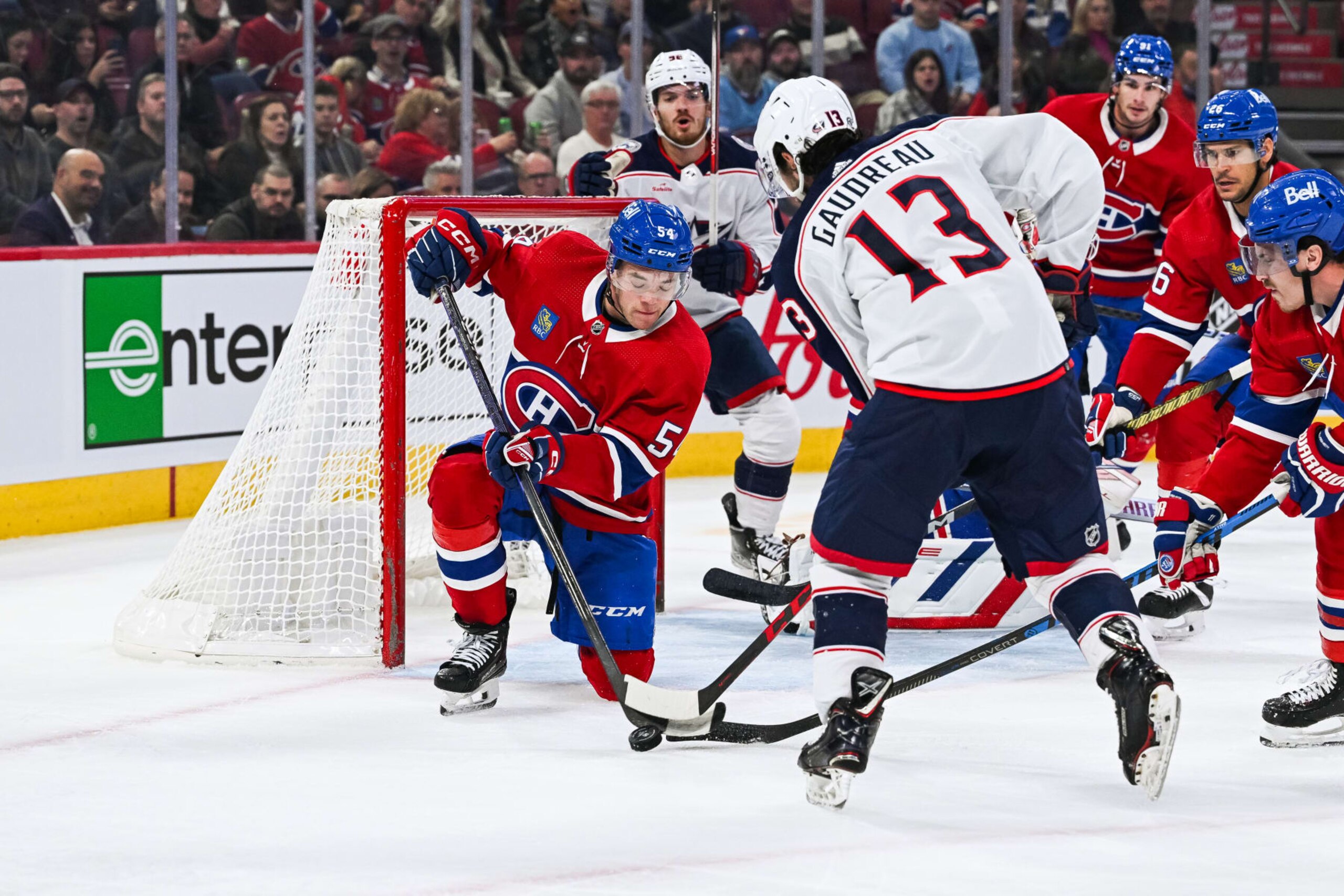 MONTREAL, QC - OCTOBER 26: Montreal Canadiens defenseman Jordan Harris (54) blocks a shot from Columbus Blue Jackets left wing Johnny Gaudreau (13) near the net during the Columbus Blue Jackets versus the Montreal Canadiens game on October 26, 2023, at Bell Centre in Montreal, QC (Photo by David Kirouac/Icon Sportswire via Getty Images) MONTREAL, QC - OCTOBER 26: Montreal Canadiens defenseman Jordan Harris (54) blocks a shot from Columbus Blue Jackets left wing Johnny Gaudreau (13) near the net during the Columbus Blue Jackets versus the Montreal Canadiens game on October 26, 2023, at Bell Centre in Montreal, QC (Photo by David Kirouac/Icon Sportswire via Getty Images)