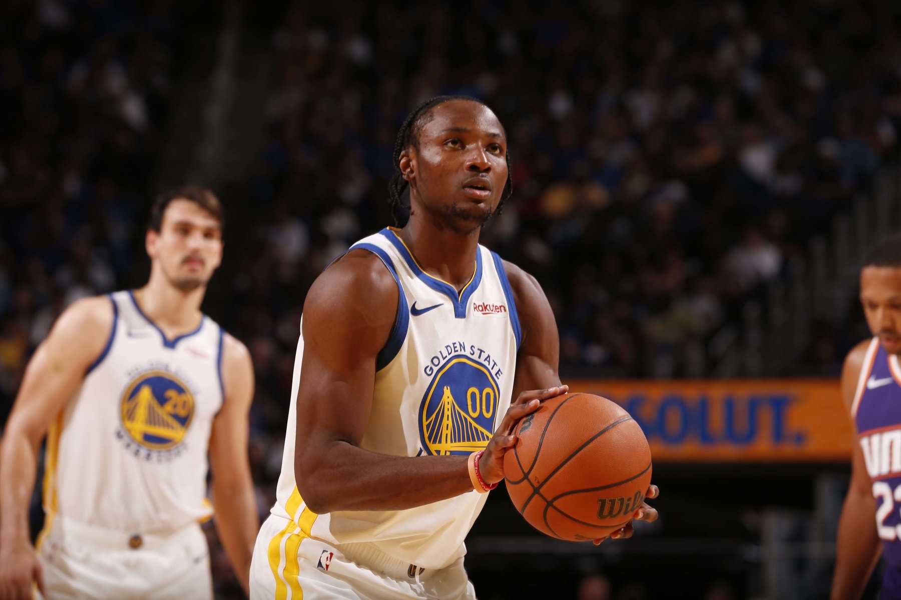 SAN FRANCISCO, CA - OCTOBER 24:  Jonathan Kuminga #00 of the Golden State Warriors shoots a free throw during the game against the Phoenix Suns on October 24, 2023 at Chase Center in San Francisco, California. NOTE TO USER: User expressly acknowledges and agrees that, by downloading and or using this photograph, user is consenting to the terms and conditions of Getty Images License Agreement. Mandatory Copyright Notice: Copyright 2023 NBAE (Photo by Jed Jacobsohn/NBAE via Getty Images)
