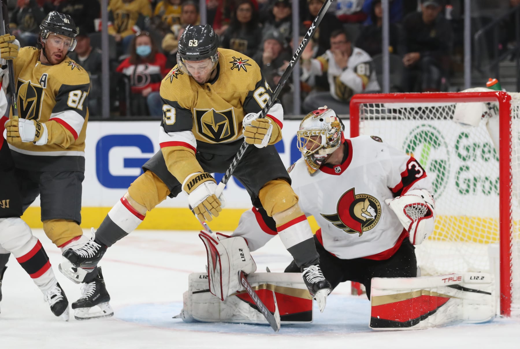 LAS VEGAS, NEVADA - MARCH 06: Evgenii Dadonov #63 of the Vegas Golden Knights sets a screen in front of Anton Forsberg #31 of the Ottawa Senators during the second period at T-Mobile Arena on March 06, 2022 in Las Vegas, Nevada. (Photo by Zak Krill/NHLI via Getty Images)