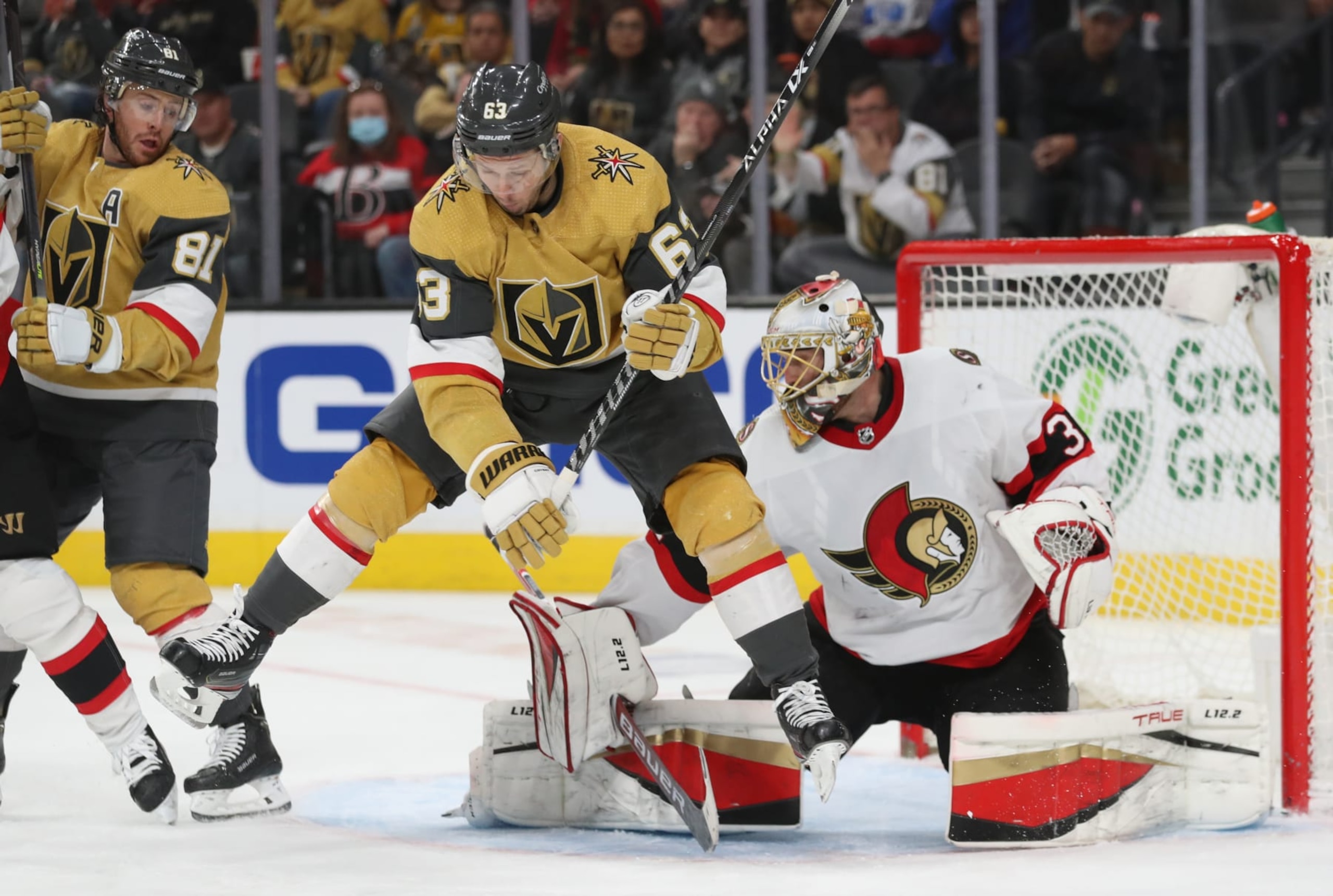 LAS VEGAS, NEVADA - MARCH 06: Evgenii Dadonov #63 of the Vegas Golden Knights sets a screen in front of Anton Forsberg #31 of the Ottawa Senators during the second period at T-Mobile Arena on March 06, 2022 in Las Vegas, Nevada. (Photo by Zak Krill/NHLI via Getty Images) LAS VEGAS, NEVADA - MARCH 06: Evgenii Dadonov #63 of the Vegas Golden Knights sets a screen in front of Anton Forsberg #31 of the Ottawa Senators during the second period at T-Mobile Arena on March 06, 2022 in Las Vegas, Nevada. (Photo by Zak Krill/NHLI via Getty Images)