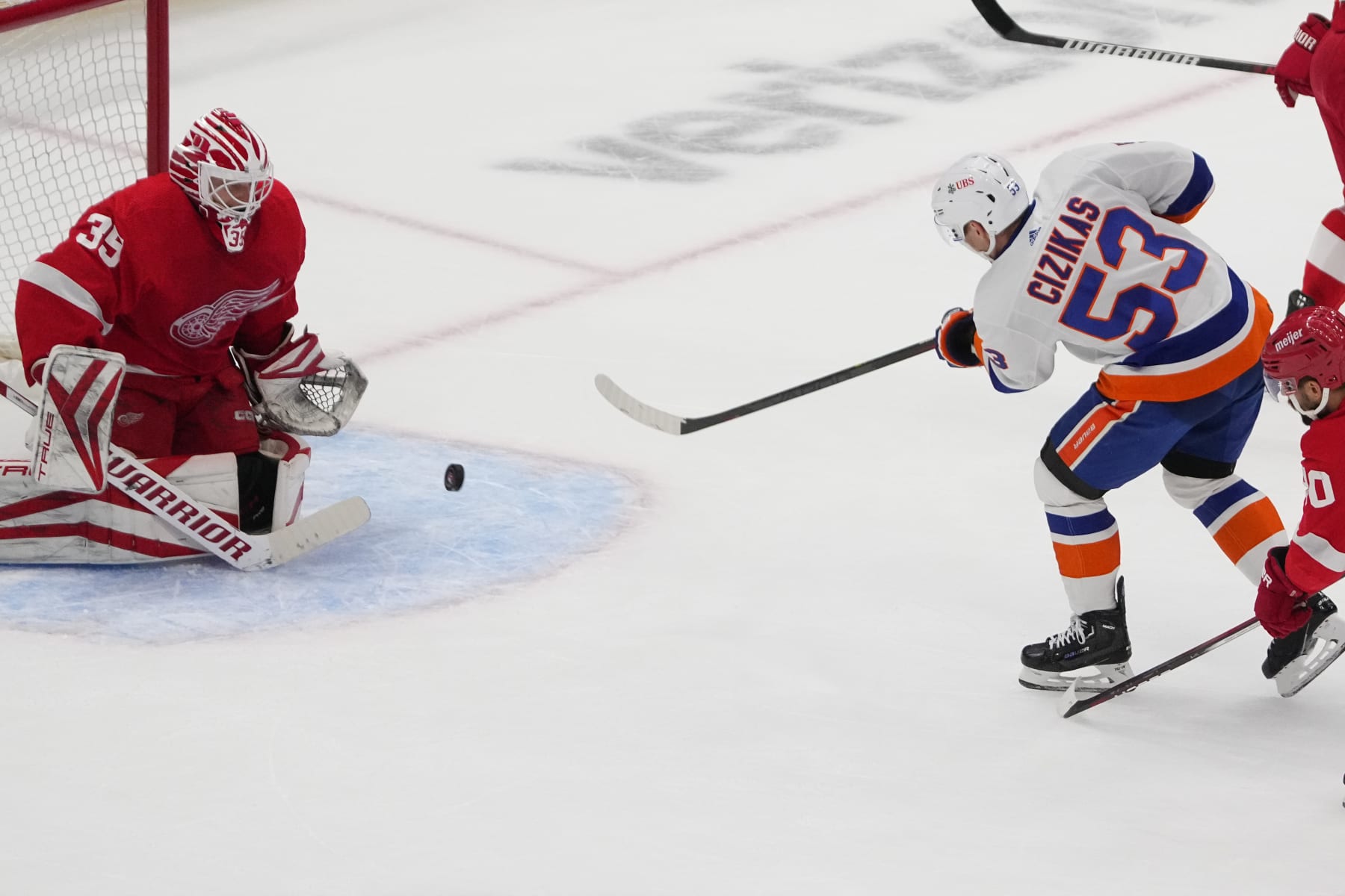 ELMONT, NY - OCTOBER 30: New York Islanders Center Casey Cizikas (53) takes a shot on Detroit Red Wings Goalie Ville Husso (35) during the first period of the National Hockey League game between the Detroit Red Wings and the New York Islanders on October 30, 2023, at UBS Arena in Elmont, NY. (Photo by Gregory Fisher/Icon Sportswire via Getty Images)
