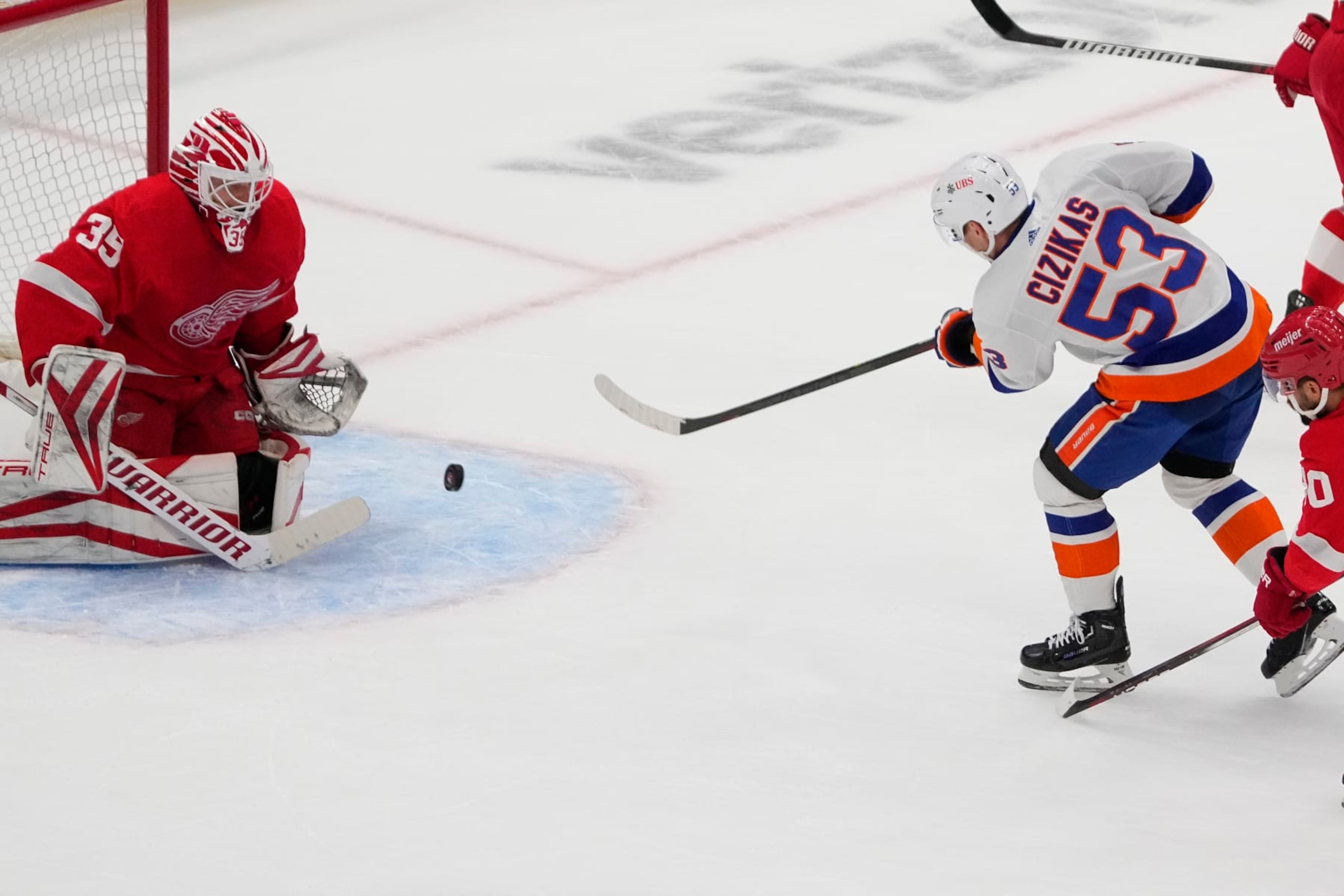 ELMONT, NY - OCTOBER 30: New York Islanders Center Casey Cizikas (53) takes a shot on Detroit Red Wings Goalie Ville Husso (35) during the first period of the National Hockey League game between the Detroit Red Wings and the New York Islanders on October 30, 2023, at UBS Arena in Elmont, NY. (Photo by Gregory Fisher/Icon Sportswire via Getty Images) ELMONT, NY - OCTOBER 30: New York Islanders Center Casey Cizikas (53) takes a shot on Detroit Red Wings Goalie Ville Husso (35) during the first period of the National Hockey League game between the Detroit Red Wings and the New York Islanders on October 30, 2023, at UBS Arena in Elmont, NY. (Photo by Gregory Fisher/Icon Sportswire via Getty Images)