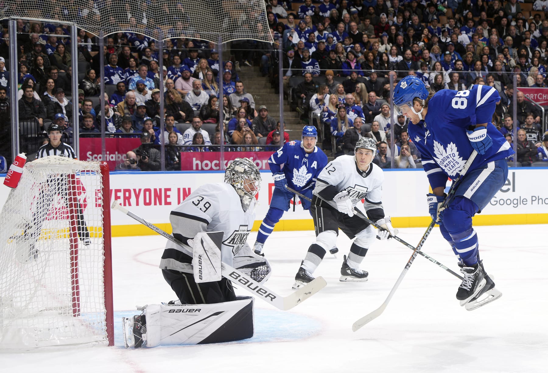 TORONTO, ON - OCTOBER 31:  John Tavares #91 of the Toronto Maple Leafs scores a goal on Cam Talbot #39 of the Los Angeles Kings as William Nylander #88 avoids the shot in the third period at the Scotiabank Arena on October 31, 2023 in Toronto, Ontario, Canada.   (Photo by Mark Blinch/NHLI via Getty Images)