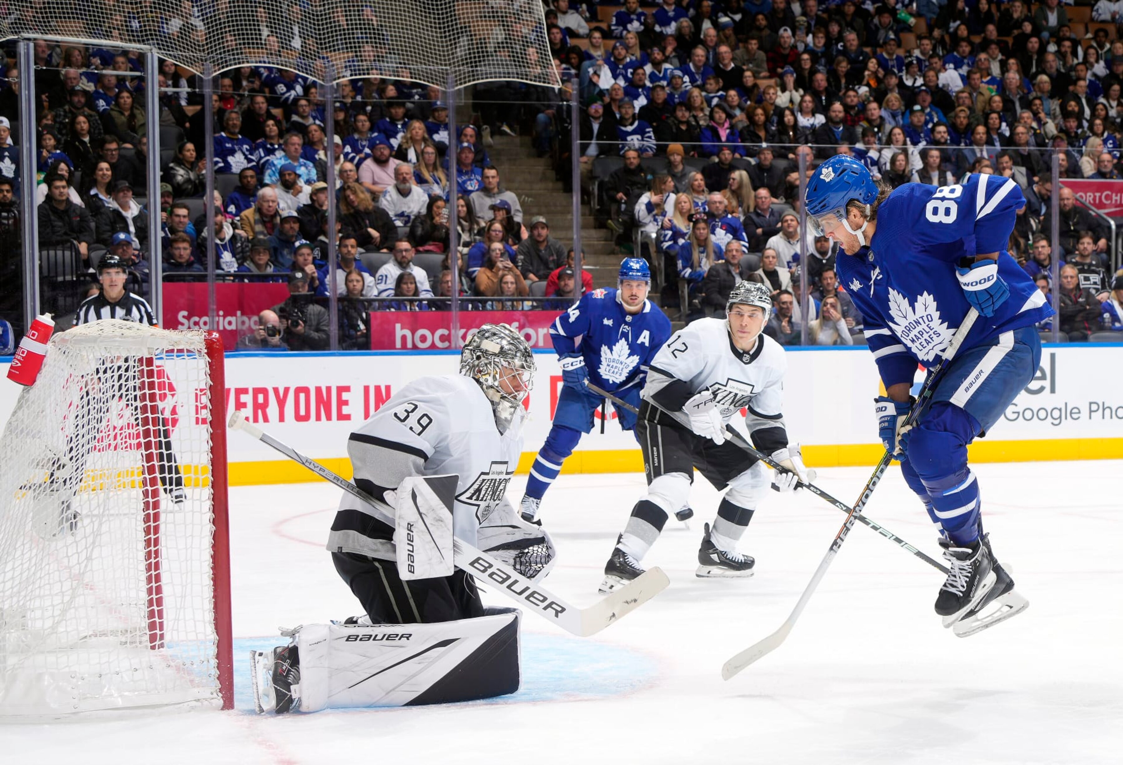 TORONTO, ON - OCTOBER 31:  John Tavares #91 of the Toronto Maple Leafs scores a goal on Cam Talbot #39 of the Los Angeles Kings as William Nylander #88 avoids the shot in the third period at the Scotiabank Arena on October 31, 2023 in Toronto, Ontario, Canada.   (Photo by Mark Blinch/NHLI via Getty Images)