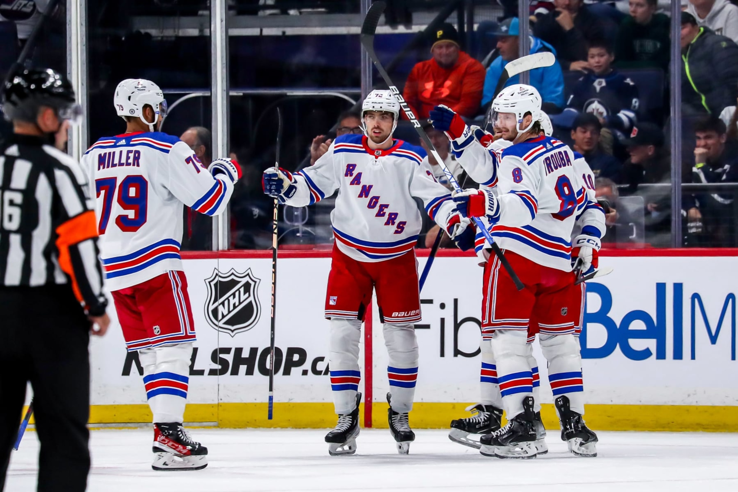 WINNIPEG, CANADA - OCTOBER 30: K'Andre Miller #79, Filip Chytil #72, Jacob Trouba #8 and Artemi Panarin #10 of the New York Rangers celebrate a first period goal against the Winnipeg Jets at the Canada Life Centre on October 30, 2023 in Winnipeg, Manitoba, Canada. (Photo by Darcy Finley/NHLI via Getty Images) WINNIPEG, CANADA - OCTOBER 30: K'Andre Miller #79, Filip Chytil #72, Jacob Trouba #8 and Artemi Panarin #10 of the New York Rangers celebrate a first period goal against the Winnipeg Jets at the Canada Life Centre on October 30, 2023 in Winnipeg, Manitoba, Canada. (Photo by Darcy Finley/NHLI via Getty Images)