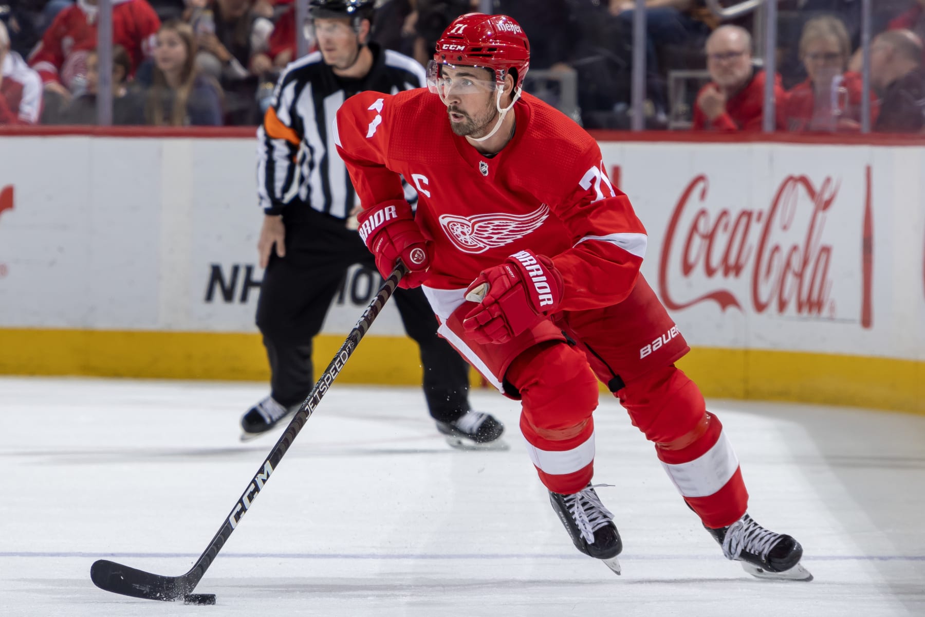 DETROIT, MI - OCTOBER 26: Dylan Larkin #71 of the Detroit Red Wings skates up ice with the puck against the Winnipeg Jets during the third period at Little Caesars Arena on October 26, 2023 in Detroit, Michigan. Winnipeg defeated Detroit 4-1. (Photo by Dave Reginek/NHLI via Getty Images)