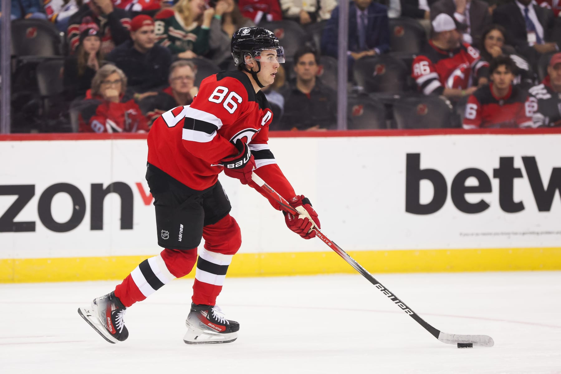 NEWARK, NJ - OCTOBER 29: New Jersey Devils center Jack Hughes (86) skates with the puck during a game between the Minnesota Wild and New Jersey Devils on October 29, 2023 at Prudential Center in the Newark, New Jersey.(Photo by Andrew Mordzynski/Icon Sportswire via Getty Images)