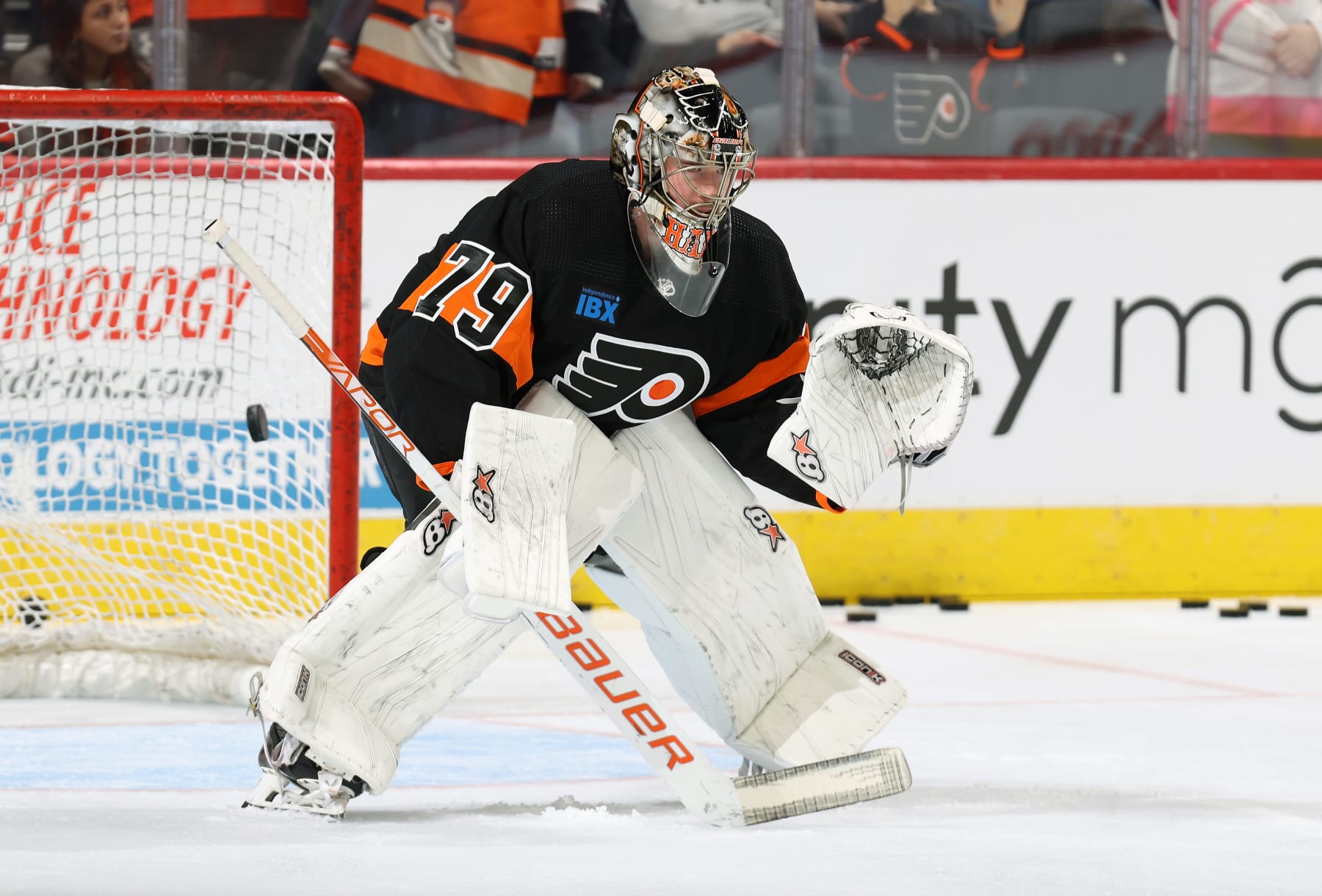PHILADELPHIA, PENNSYLVANIA - OCTOBER 28:  Carter Hart #79 of the Philadelphia Flyers takes shots on goal during warm-ups prior to his game against the Anaheim Ducks at the Wells Fargo Center on October 28, 2023 in Philadelphia, Pennsylvania.  (Photo by Len Redkoles/NHLI via Getty Images)