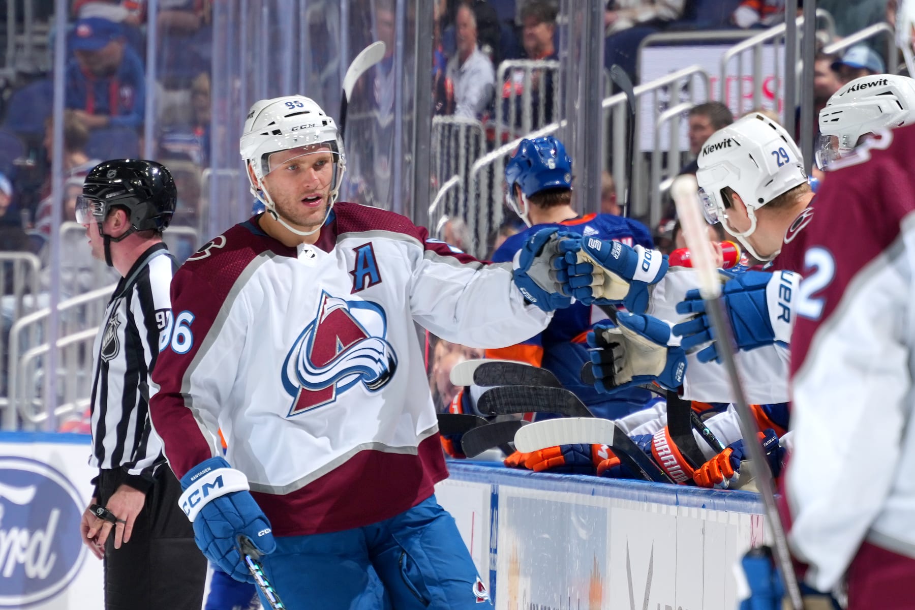 ELMONT, NEW YORK - OCTOBER 24:  Mikko Rantanen #96 of the Colorado Avalanche is congratulated by his teammates after scoring a goal against the New York Islanders during the third period at UBS Arena on October 24, 2023 in Elmont, New York. (Photo by Mike Stobe/NHLI via Getty Images)