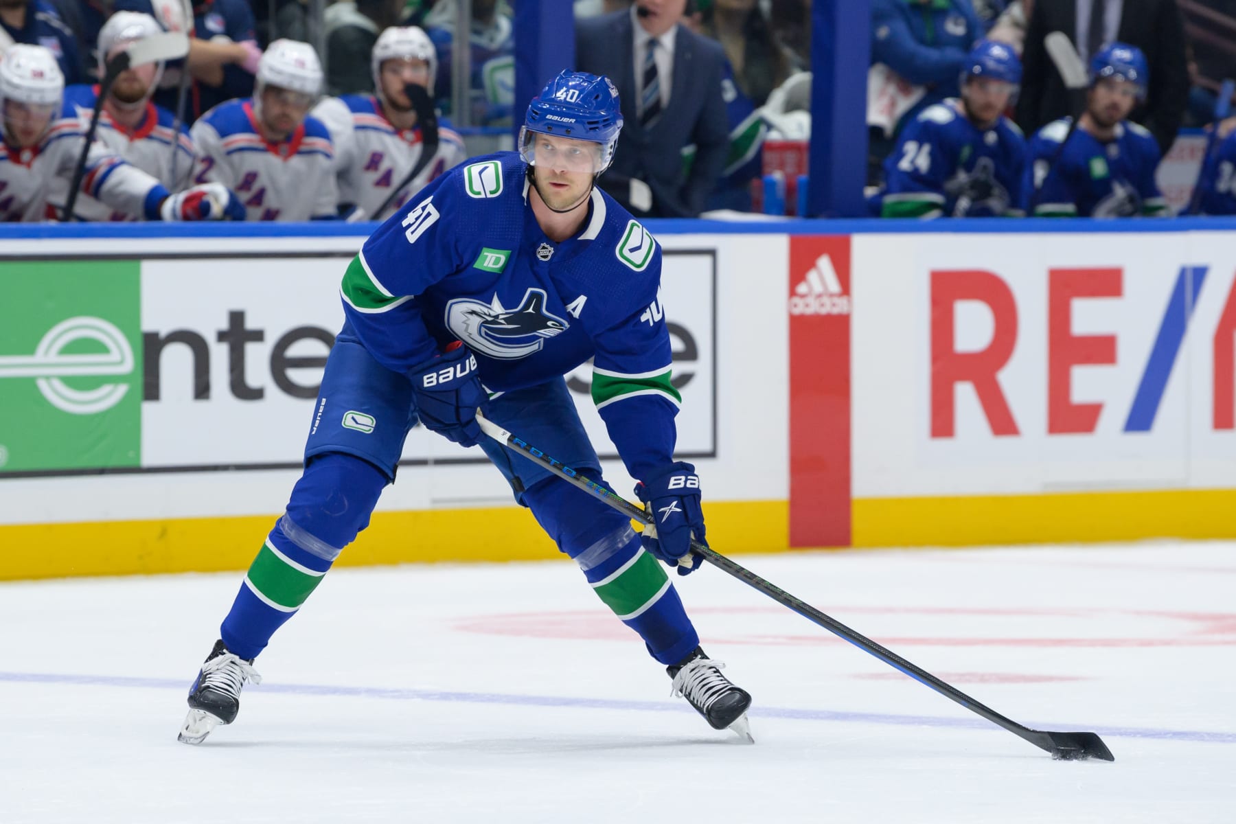 VANCOUVER, CANADA - OCTOBER 28: Elias Pettersson #40 of the Vancouver Canucks skates with the puck during the first period of their NHL game against the New York Rangers at Rogers Arena on October 28, 2023 in Vancouver, British Columbia, Canada. (Photo by Derek Cain/Getty Images)