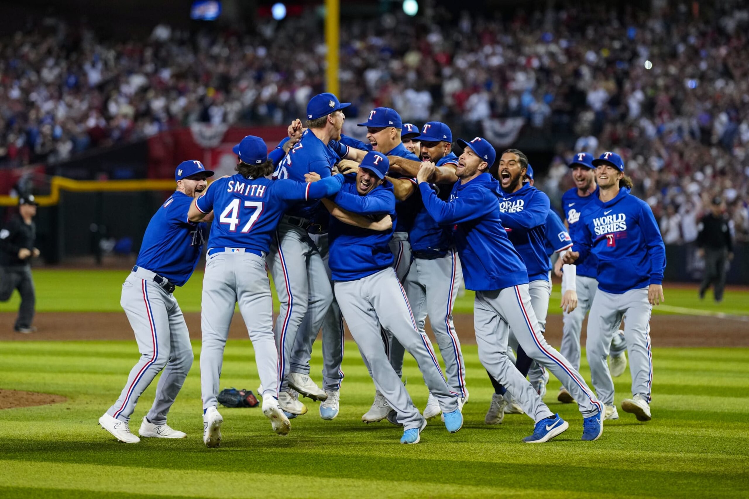 PHOENIX, AZ - NOVEMBER 01: Members of the Texas Rangers celebrate after winning against the Arizona Diamondbacks in Game 5 of the 2023 World Series at Chase Field on Wednesday, November 1, 2023 in Phoenix, Arizona. The Texas Rangers won the World Series 5-0. (Photo by Daniel Shirey/MLB Photos via Getty Images)