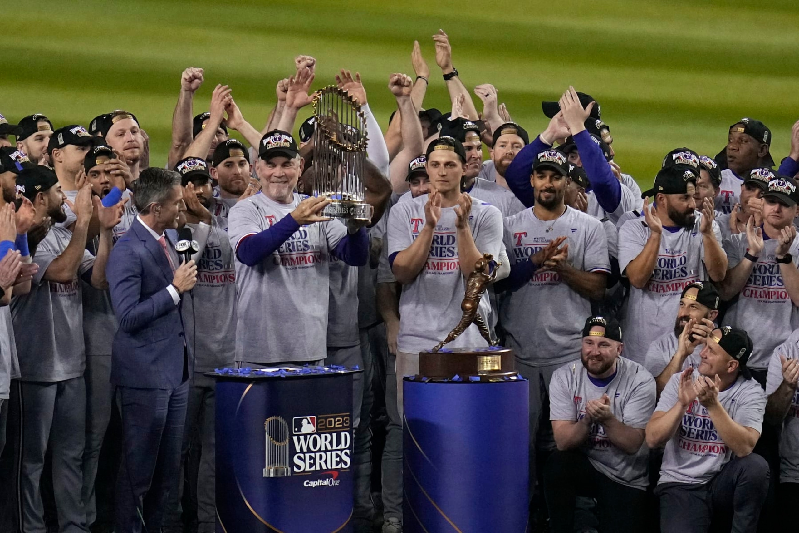Texas Rangers manager Bruce Bochy holds up the trophy after Game 5 of the baseball World Series against the Arizona Diamondbacks Wednesday, Nov. 1, 2023, in Phoenix. The Rangers won 5-0 to win the series 4-1. (AP Photo/Gregory Bull)