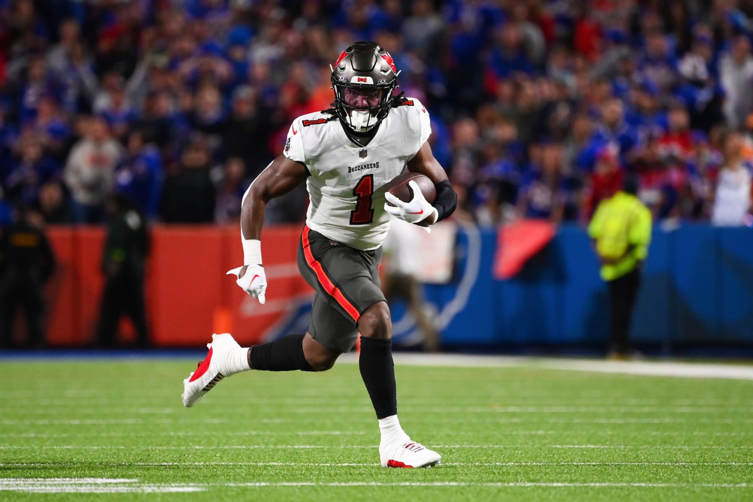 ORCHARD PARK, NEW YORK - OCTOBER 26: Rachaad White #1 of the Tampa Bay Buccaneers carries the ball against the Buffalo Bills during the first half of the game at Highmark Stadium on October 26, 2023 in Orchard Park, New York. (Photo by Rich Barnes/Getty Images)