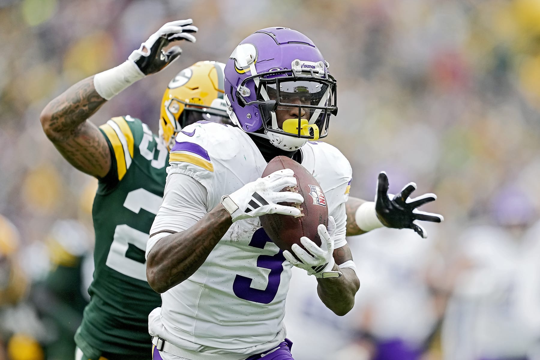 GREEN BAY, WISCONSIN - OCTOBER 29: Jordan Addison #3 of the Minnesota Vikings catches a pass for a touchdown during the third quarter of a game against the Green Bay Packers at Lambeau Field on October 29, 2023 in Green Bay, Wisconsin. (Photo by Patrick McDermott/Getty Images)