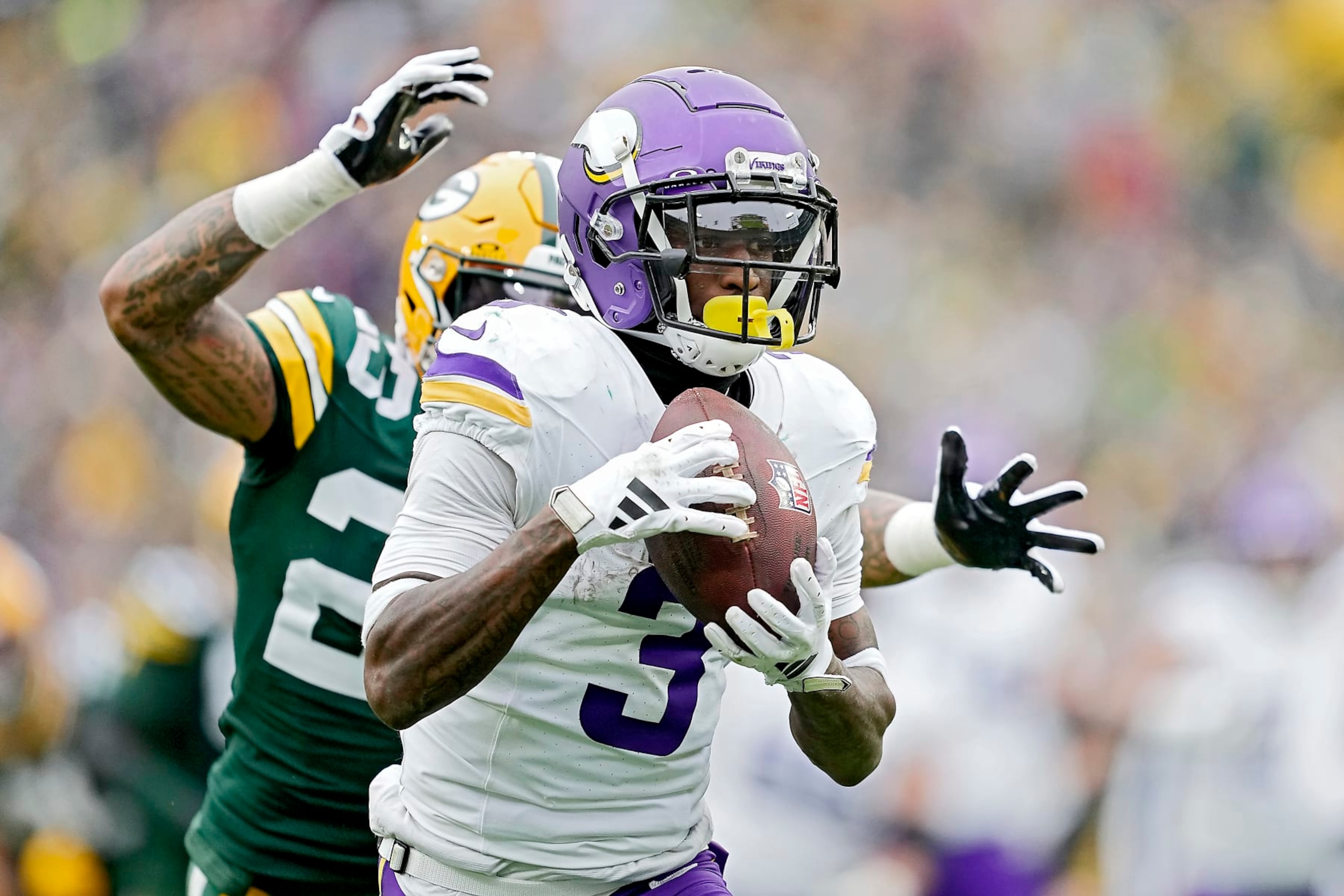 GREEN BAY, WISCONSIN - OCTOBER 29: Jordan Addison #3 of the Minnesota Vikings catches a pass for a touchdown during the third quarter of a game against the Green Bay Packers at Lambeau Field on October 29, 2023 in Green Bay, Wisconsin. (Photo by Patrick McDermott/Getty Images)