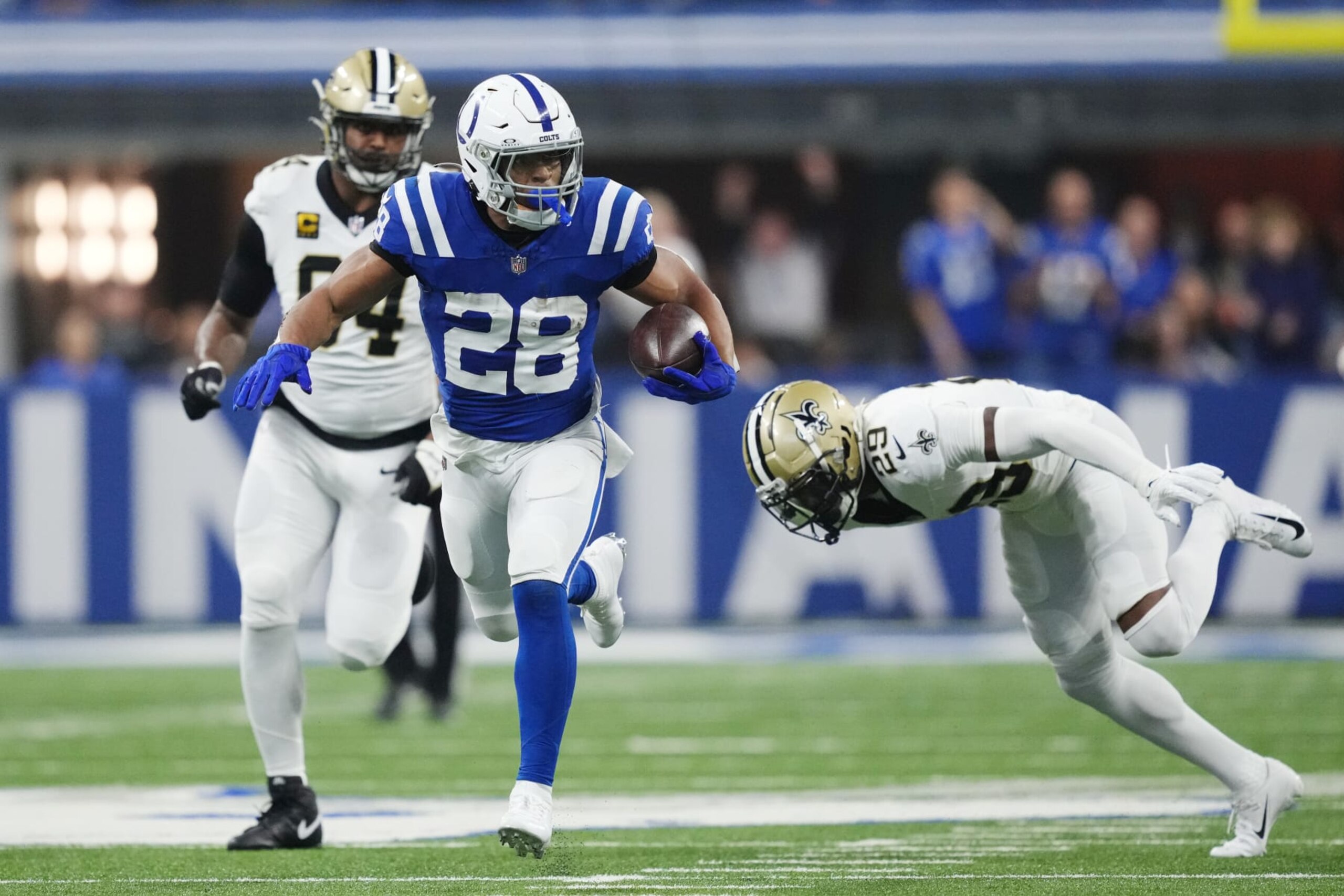 INDIANAPOLIS, INDIANA - OCTOBER 29: Jonathan Taylor #28 of the Indianapolis Colts runs past Paulson Adebo #29 of the New Orleans Saints during the first quarter at Lucas Oil Stadium on October 29, 2023 in Indianapolis, Indiana. (Photo by Dylan Buell/Getty Images) INDIANAPOLIS, INDIANA - OCTOBER 29: Jonathan Taylor #28 of the Indianapolis Colts runs past Paulson Adebo #29 of the New Orleans Saints during the first quarter at Lucas Oil Stadium on October 29, 2023 in Indianapolis, Indiana. (Photo by Dylan Buell/Getty Images)