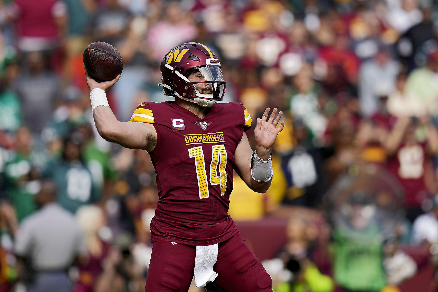 LANDOVER, MARYLAND - OCTOBER 29: Sam Howell #14 of the Washington Commanders throws a pass in the third quarter of a game against the Philadelphia Eagles at FedExField on October 29, 2023 in Landover, Maryland. (Photo by Jess Rapfogel/Getty Images)
