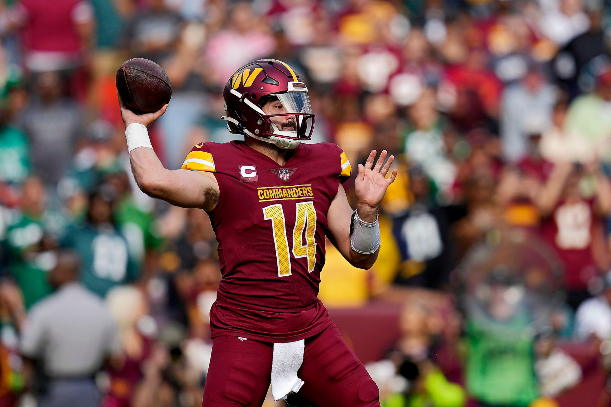 LANDOVER, MARYLAND - OCTOBER 29: Sam Howell #14 of the Washington Commanders throws a pass in the third quarter of a game against the Philadelphia Eagles at FedExField on October 29, 2023 in Landover, Maryland. (Photo by Jess Rapfogel/Getty Images)