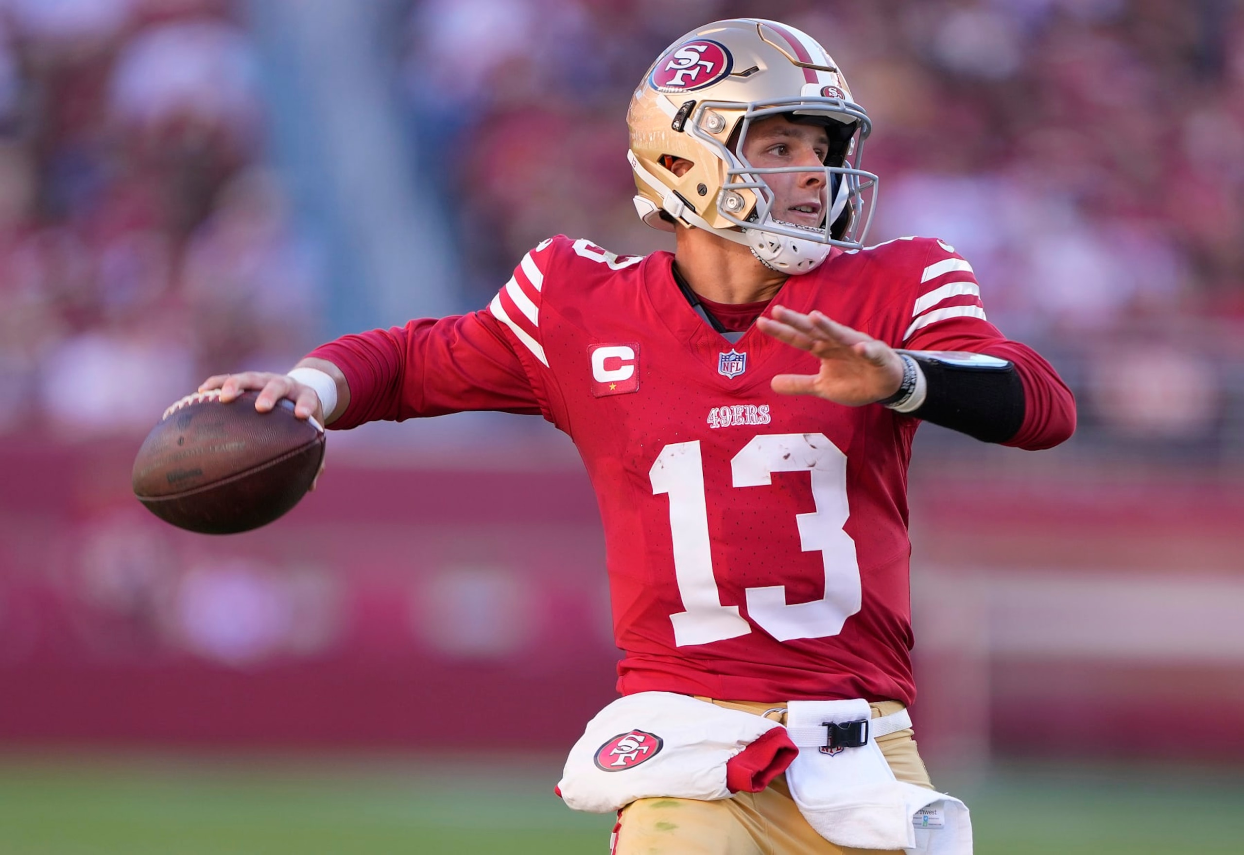 SANTA CLARA, CALIFORNIA - OCTOBER 29: Brock Purdy #13 of the San Francisco 49ers scrambles with the ball looking to pass against the Cincinnati Bengals during the fourth quarter of an NFL football game at Levi's Stadium on October 29, 2023 in Santa Clara, California. (Photo by Thearon W. Henderson/Getty Images)