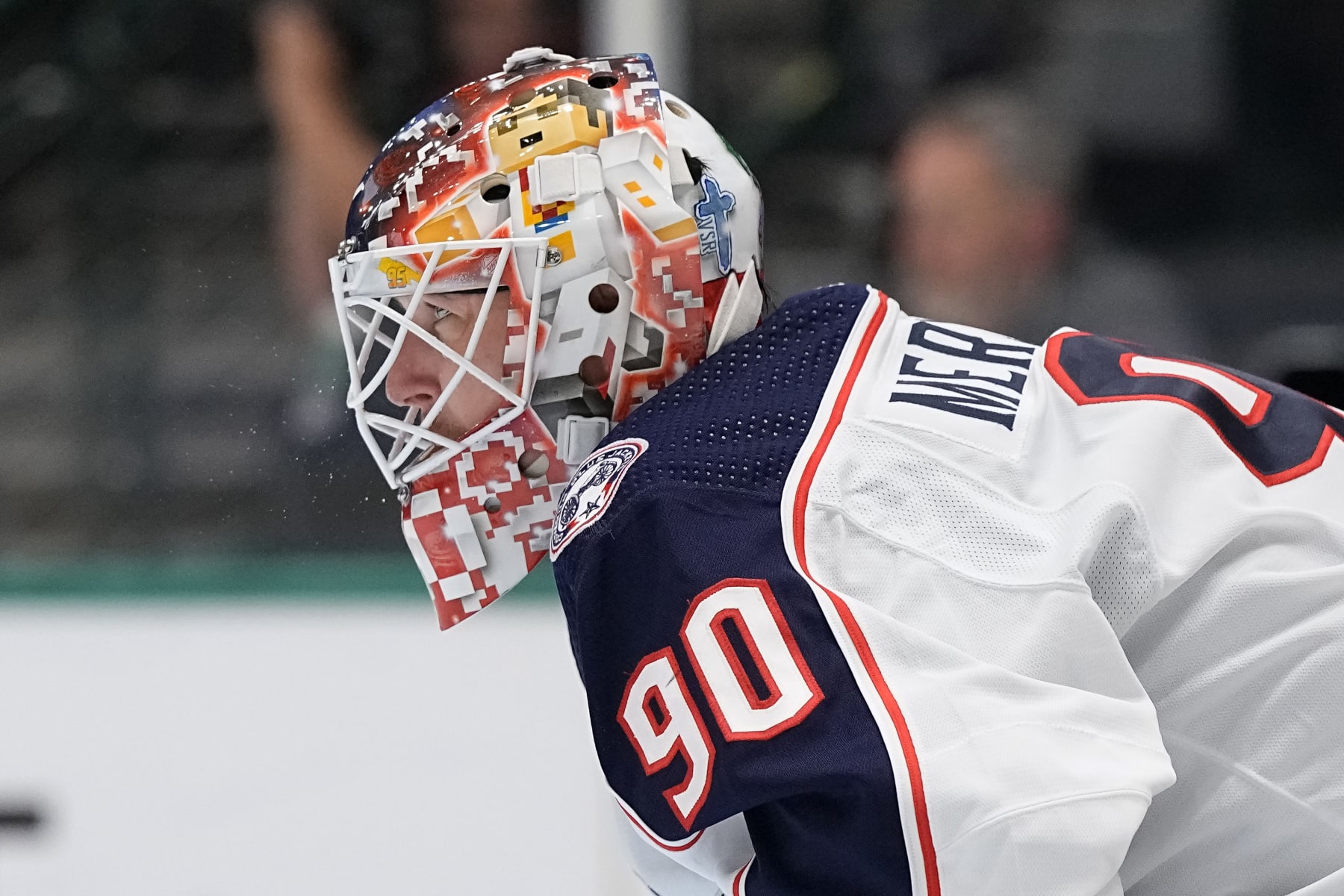DALLAS, TEXAS - OCTOBER 30: A detail view of the mask of Elvis Merzlikins #90 of the Columbus Blue Jackets during the first period of the game against the Dallas Stars at American Airlines Center on October 30, 2023 in Dallas, Texas. (Photo by Sam Hodde/Getty Images)