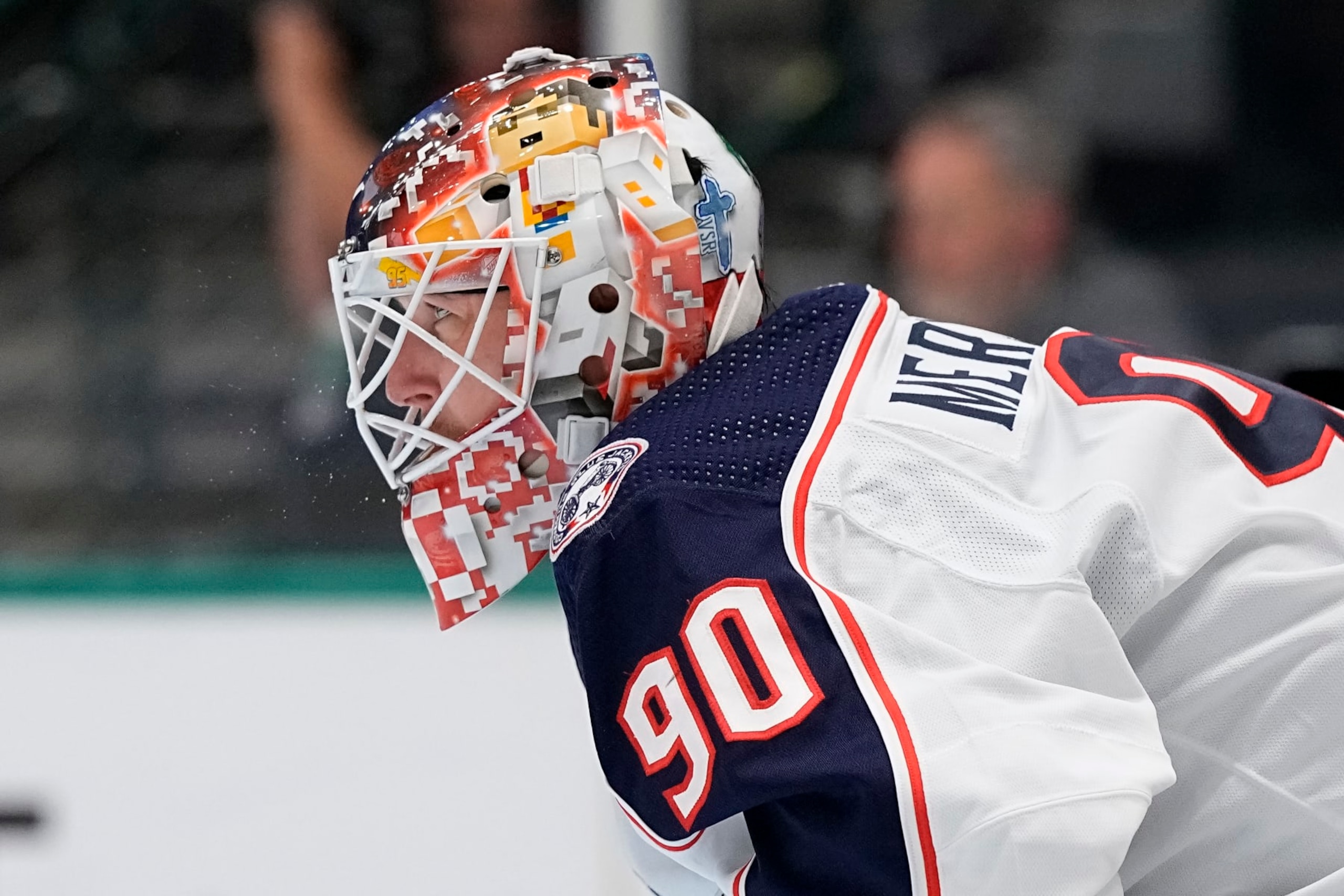 DALLAS, TEXAS - OCTOBER 30: A detail view of the mask of Elvis Merzlikins #90 of the Columbus Blue Jackets during the first period of the game against the Dallas Stars at American Airlines Center on October 30, 2023 in Dallas, Texas. (Photo by Sam Hodde/Getty Images)