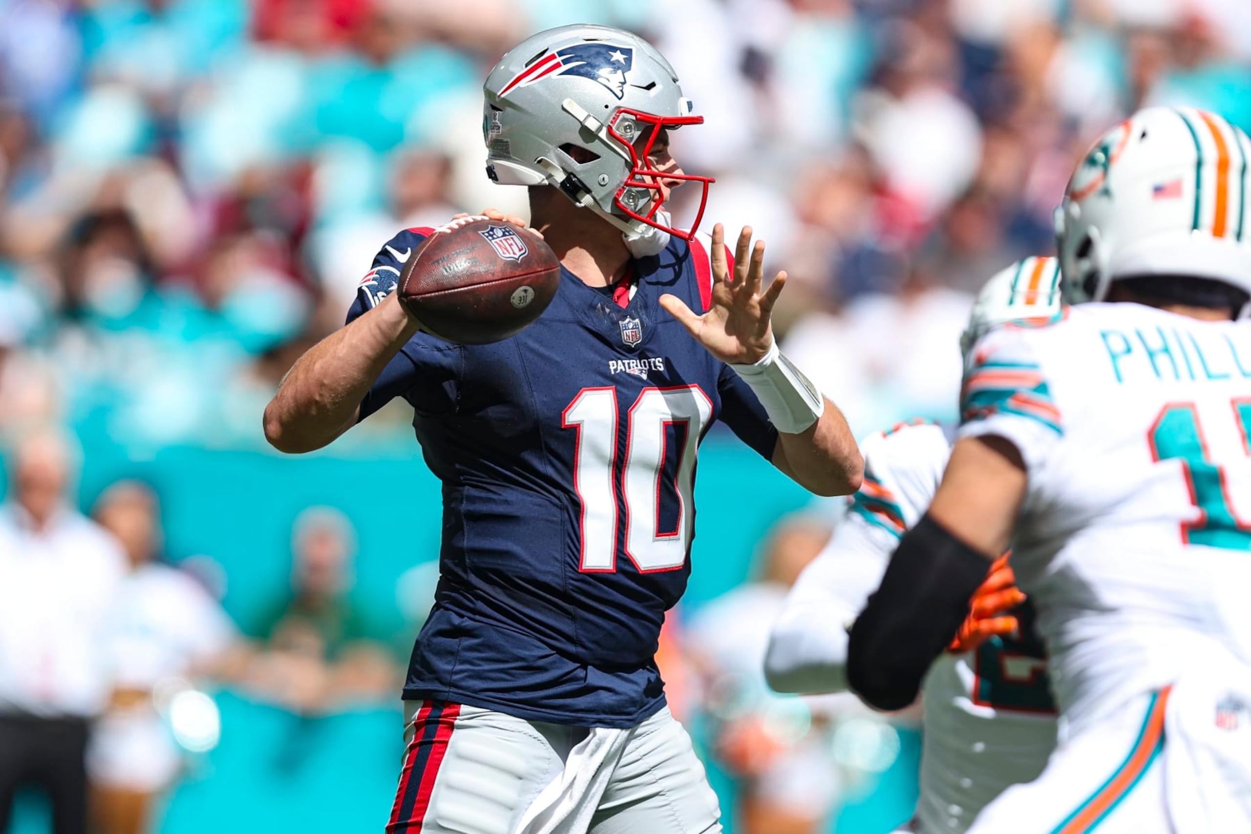 MIAMI GARDENS, FL - OCTOBER 29: Mac Jones #10 of the New England Patriots throws the ball during an NFL football game against the Miami Dolphins at Hard Rock Stadium on October 29, 2023 in Miami Gardens, Florida. (Photo by Perry Knotts/Getty Images) MIAMI GARDENS, FL - OCTOBER 29: Mac Jones #10 of the New England Patriots throws the ball during an NFL football game against the Miami Dolphins at Hard Rock Stadium on October 29, 2023 in Miami Gardens, Florida. (Photo by Perry Knotts/Getty Images)