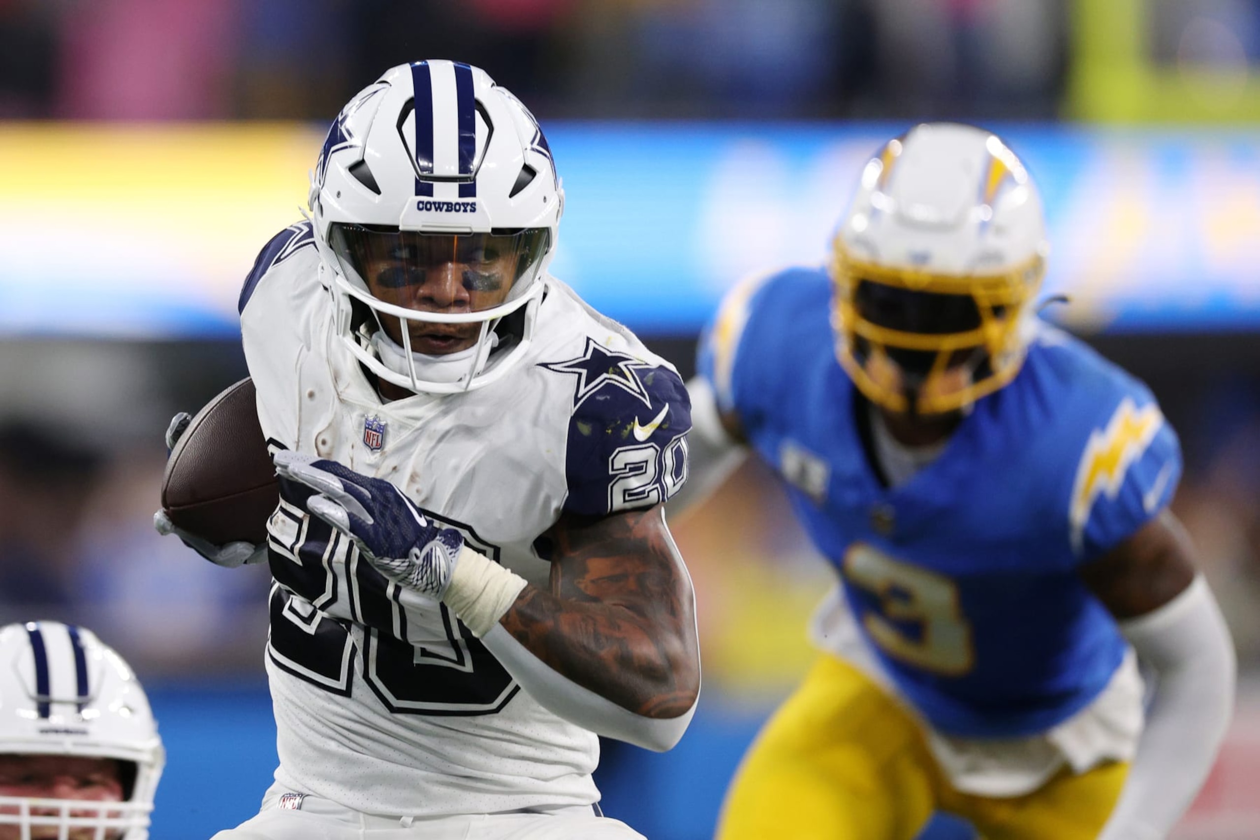 INGLEWOOD, CALIFORNIA - OCTOBER 16: Tony Pollard #20 of the Dallas Cowboys runs the ball in the first half against the Los Angeles Chargers at SoFi Stadium on October 16, 2023 in Inglewood, California. (Photo by Harry How/Getty Images)