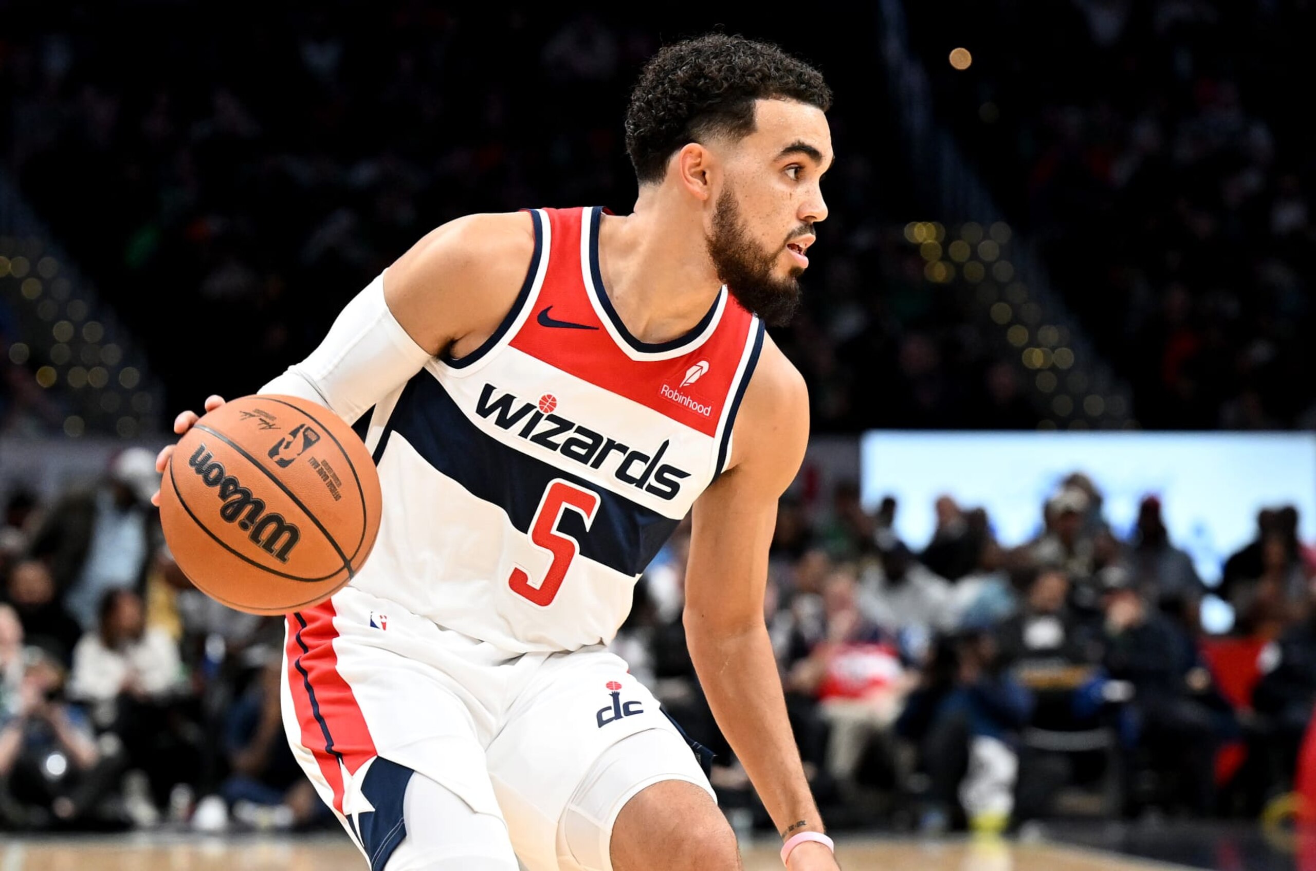 WASHINGTON, DC - OCTOBER 30: Tyus Jones #5 of the Washington Wizards handles the ball against the Boston Celtics at Capital One Arena on October 30, 2023 in Washington, DC.  NOTE TO USER: User expressly acknowledges and agrees that, by downloading and or using this photograph, User is consenting to the terms and conditions of the Getty Images License Agreement.  (Photo by G Fiume/Getty Images)