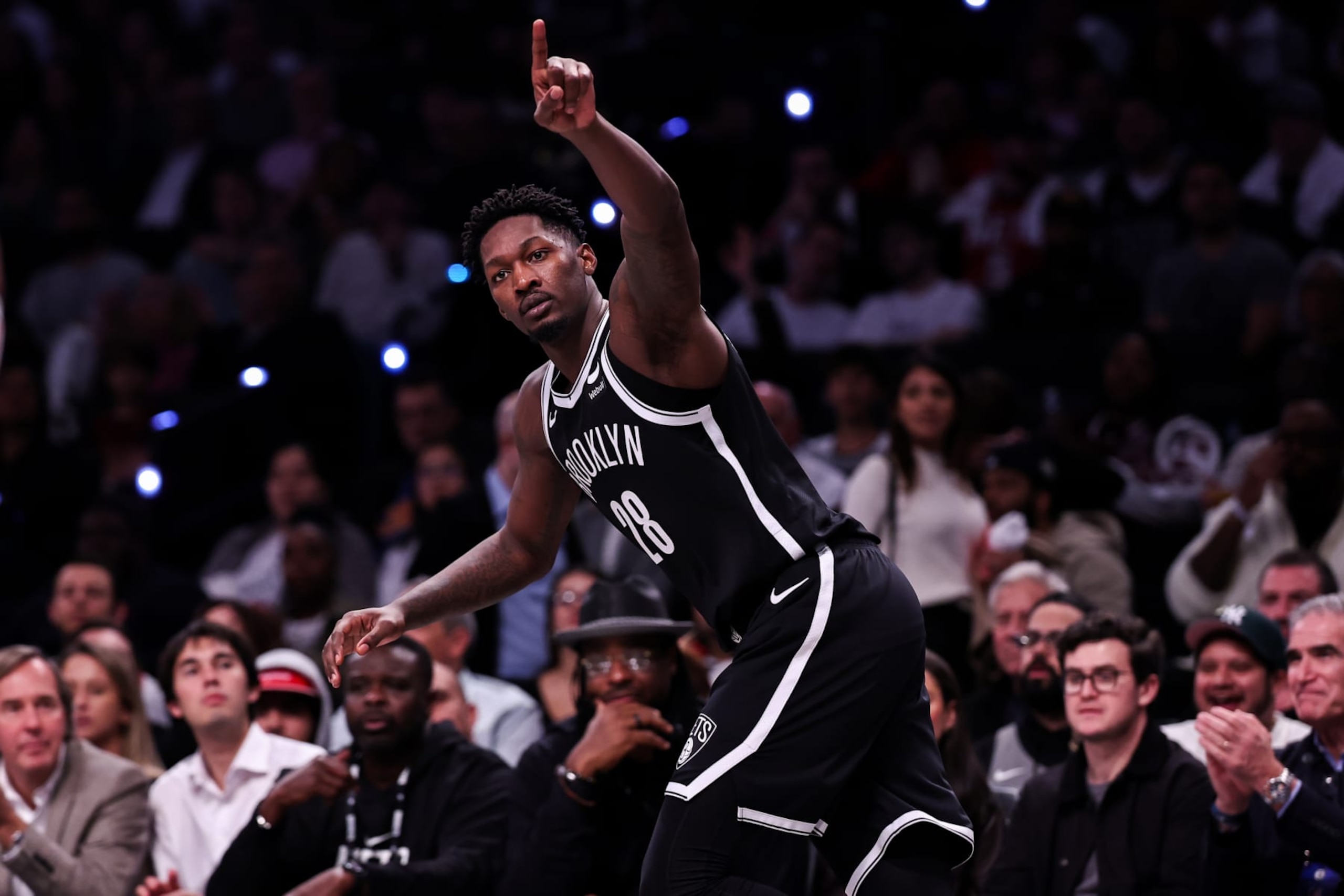 NEW YORK, NEW YORK - OCTOBER 25: Dorian Finney-Smith #28 of the Brooklyn Nets gestures after making a three-pointer during the second quarter against the Cleveland Cavaliers at Barclays Center on October 25, 2023 in New York City. NOTE TO USER: User expressly acknowledges and agrees that, by downloading and or using this photograph, User is consenting to the terms and conditions of the Getty Images License Agreement. (Photo by Dustin Satloff/Getty Images)