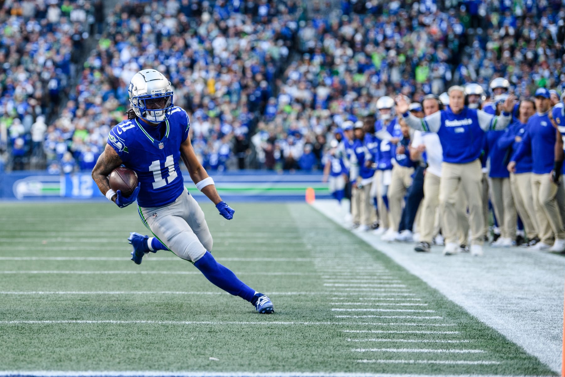 SEATTLE, WASHINGTON - OCTOBER 29: Jaxon Smith-Njigba #11 of the Seattle Seahawks carries the ball during the fourth quarter of the game against the Cleveland Browns at Lumen Field on October 29, 2023 in Seattle, Washington. (Photo by Jane Gershovich/Getty Images)