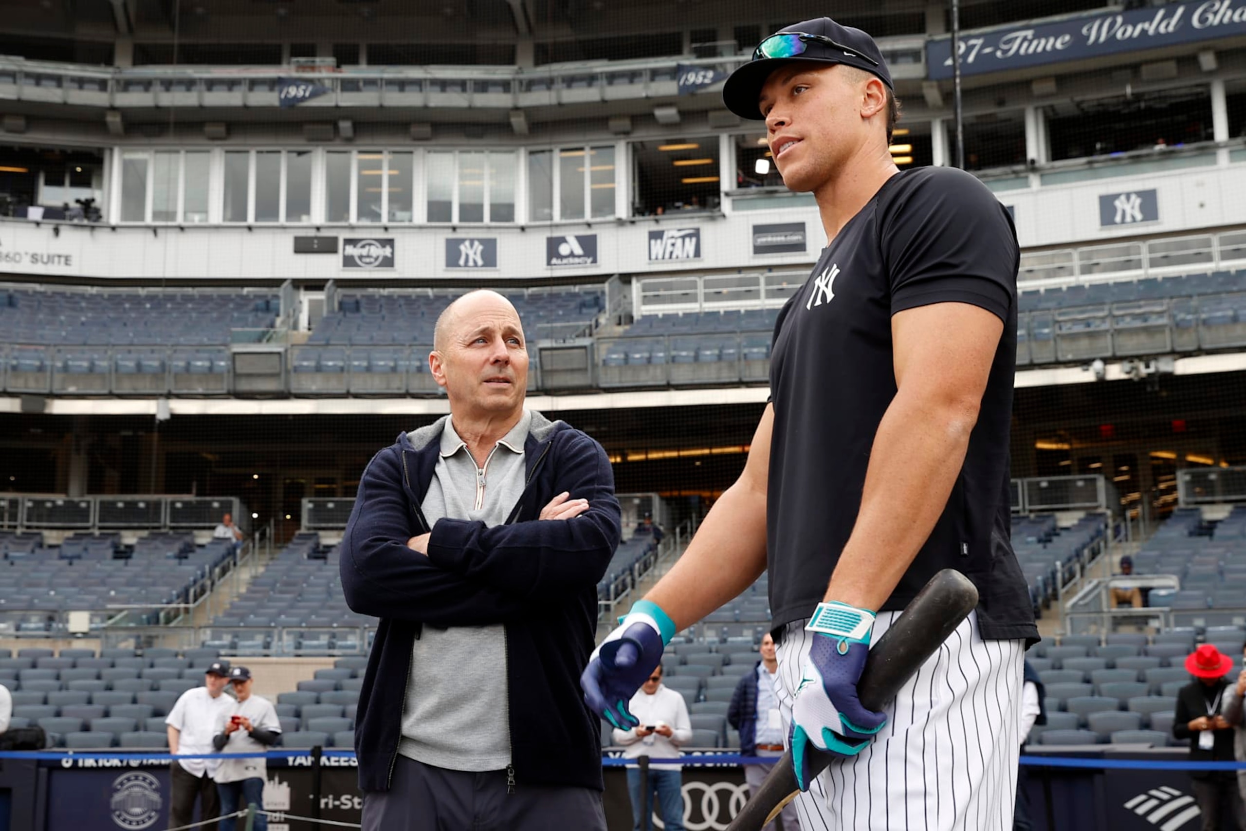 NEW YORK, NY - APRIL 4: General Manager, Brian Cashman talks to Aaron Judge #99 of the New York Yankees before the game against the Philadelphia Phillies at Yankee Stadium on April 4, 2023 in New York, New York. (Photo by New York Yankees/Getty Images)
