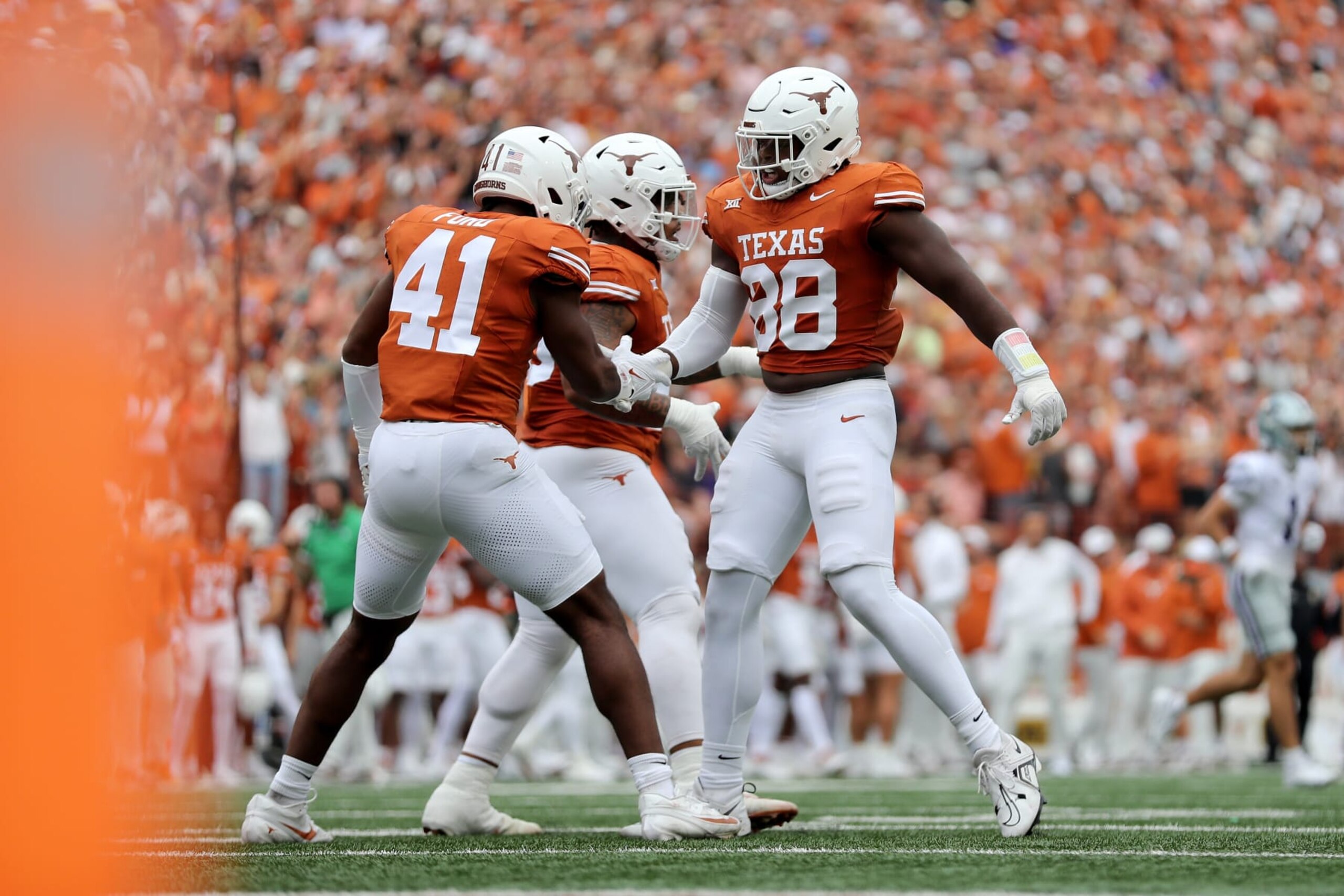AUSTIN, TEXAS - NOVEMBER 04: Barryn Sorrell #88 of the Texas Longhorns is congratulated by Jaylan Ford #41 after a sack in the first quarter against the Kansas State Wildcats at Darrell K Royal-Texas Memorial Stadium on November 04, 2023 in Austin, Texas. (Photo by Tim Warner/Getty Images)