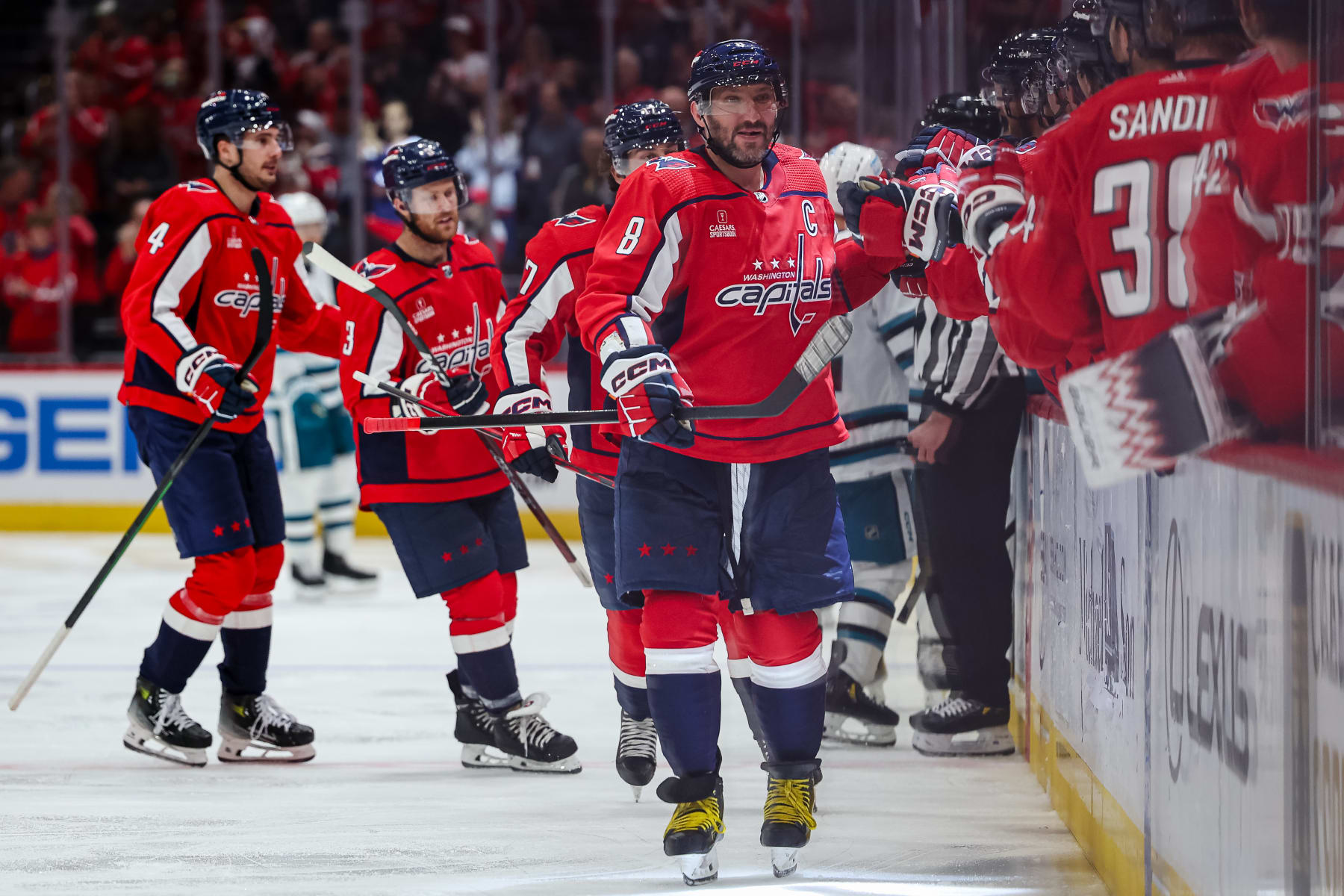 WASHINGTON, DC - OCTOBER 29: Alex Ovechkin #8 of the Washington Capitals celebrates with teammates after Dylan Strome #17 scores a goal against the San Jose Sharks during the third period of the game at Capital One Arena on October 29, 2023 in Washington, DC. (Photo by Scott Taetsch/Getty Images)