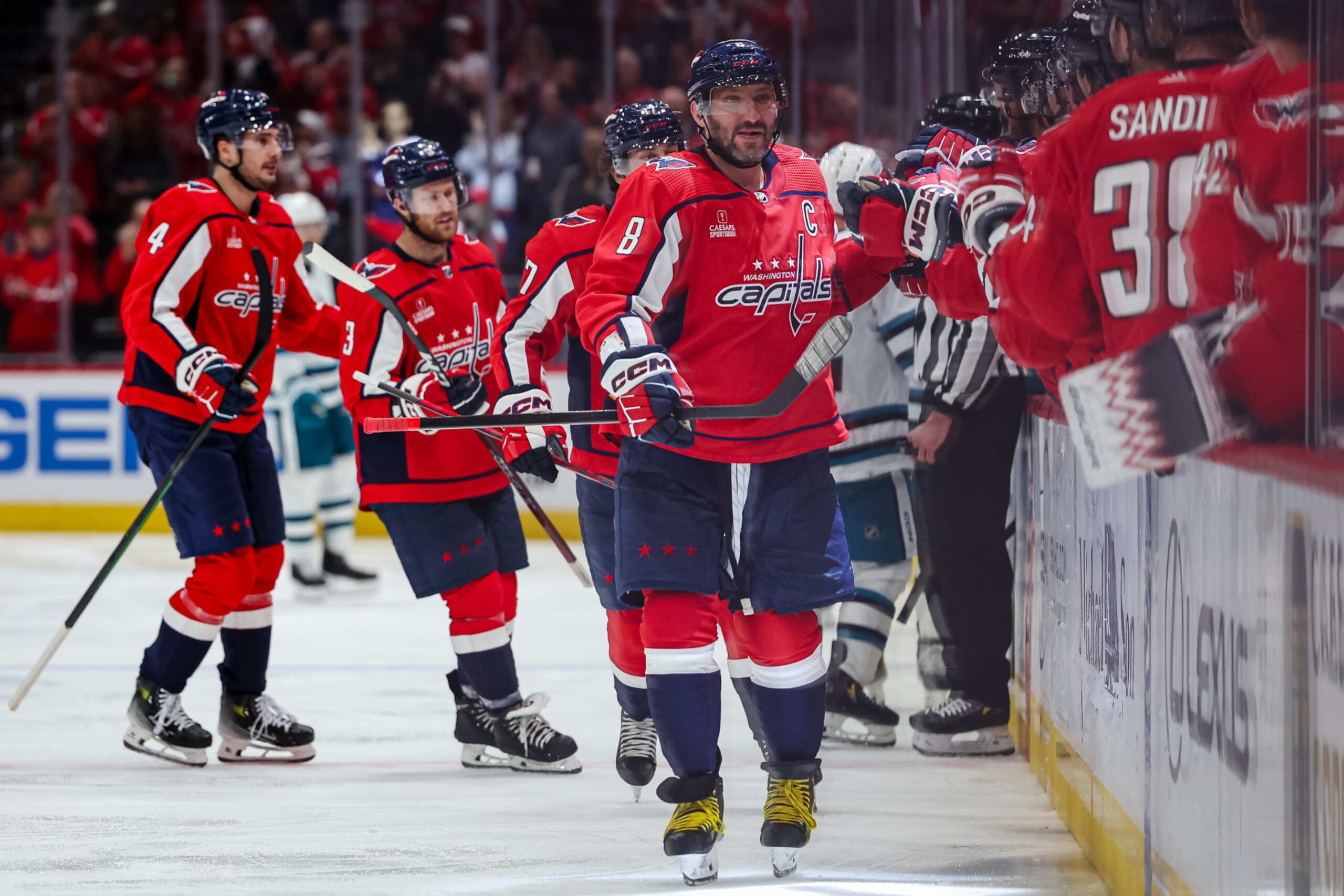 WASHINGTON, DC - OCTOBER 29: Alex Ovechkin #8 of the Washington Capitals celebrates with teammates after Dylan Strome #17 scores a goal against the San Jose Sharks during the third period of the game at Capital One Arena on October 29, 2023 in Washington, DC. (Photo by Scott Taetsch/Getty Images)