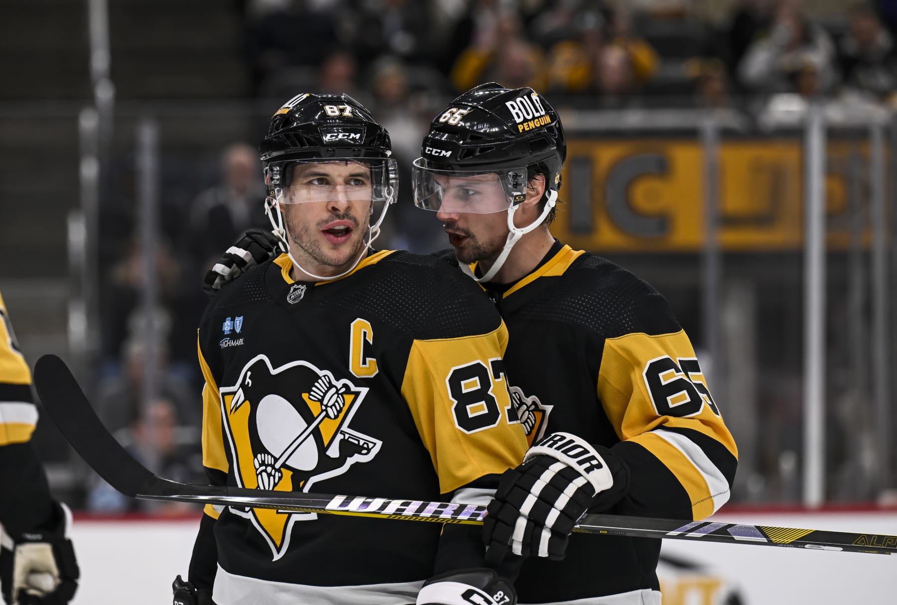 PITTSBURGH, PA - OCTOBER 30:Pittsburgh Penguins defenseman Erik Karlsson (65) talks to Pittsburgh Penguins center Sidney Crosby (87) during a break in the second period in the NHL game between the Pittsburgh Penguins and the Anaheim Ducks on October 30, 2023, at PPG Paints Arena in Pittsburgh, PA. (Photo by Jeanine Leech/Icon Sportswire via Getty Images)